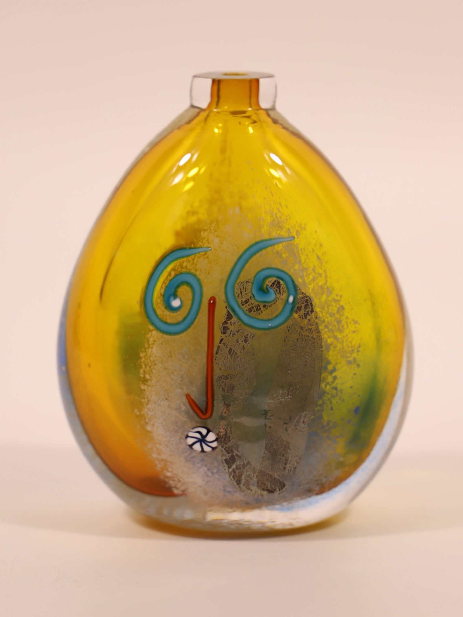 Art Glass Vase: Blown glass vase with two "faces" on either side; Possibly from Fineline Studios; No signature/maker marks observed; Measures approximately H 6 x W 4 1/4 x D 2 1/2 inches; No damage observed. See phot