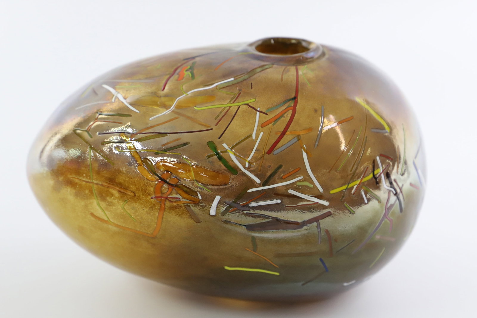 Art Glass Vase: Egg shaped, blown glass vase; No maker marks observed; Measures approximately H 5 1/4 x W 6 x D 6 inches; No damage observed; See photos