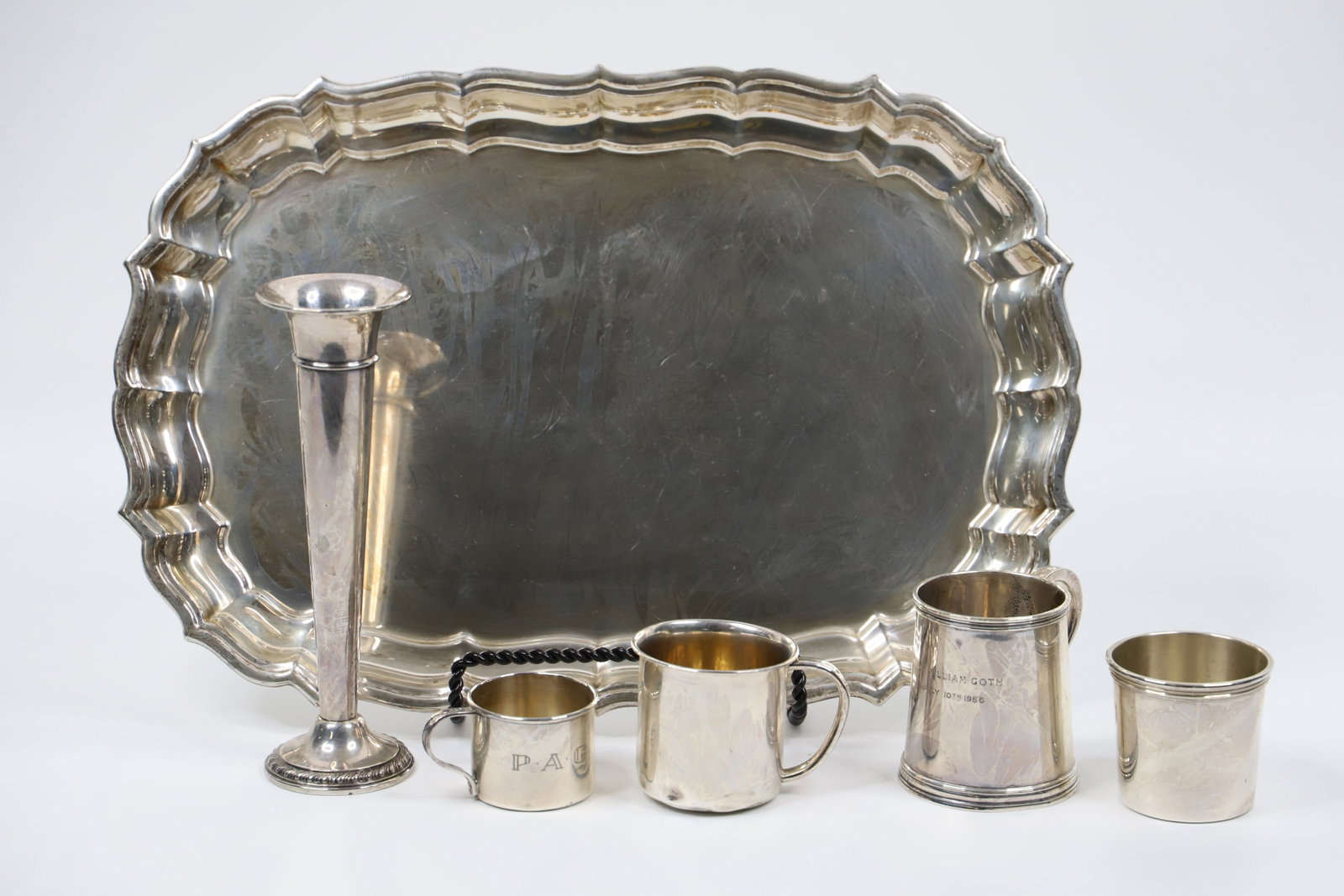 Sterling Silver Cups, Tray: Reed and Barton silver tray has engraving on the back (Given as an award); Largest cup has British Hallmarks; One other cup is marked "Wallace"; Fluted vase is Cornwall weight sterling: All pieces, ex