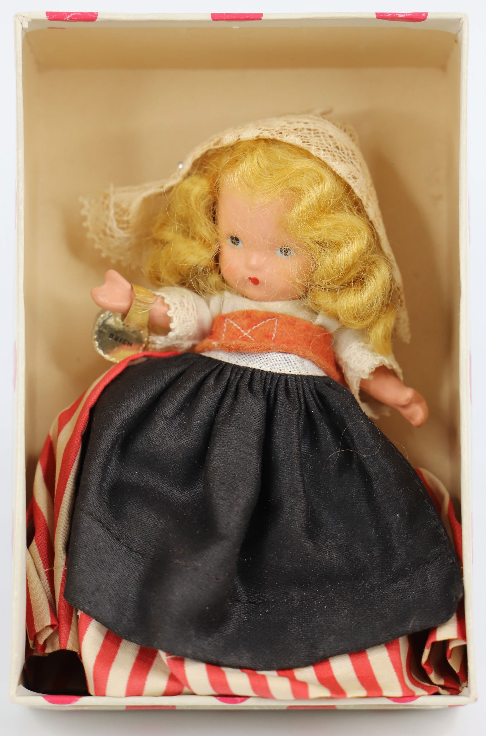 Nancy Ann Storybook Doll: Around the World Series; "Dutch"; Number 27; Bisque with painted face; Gold label on right wrist; Measures approximately H 5 inches; No guarantee doll is in correct box. See photos