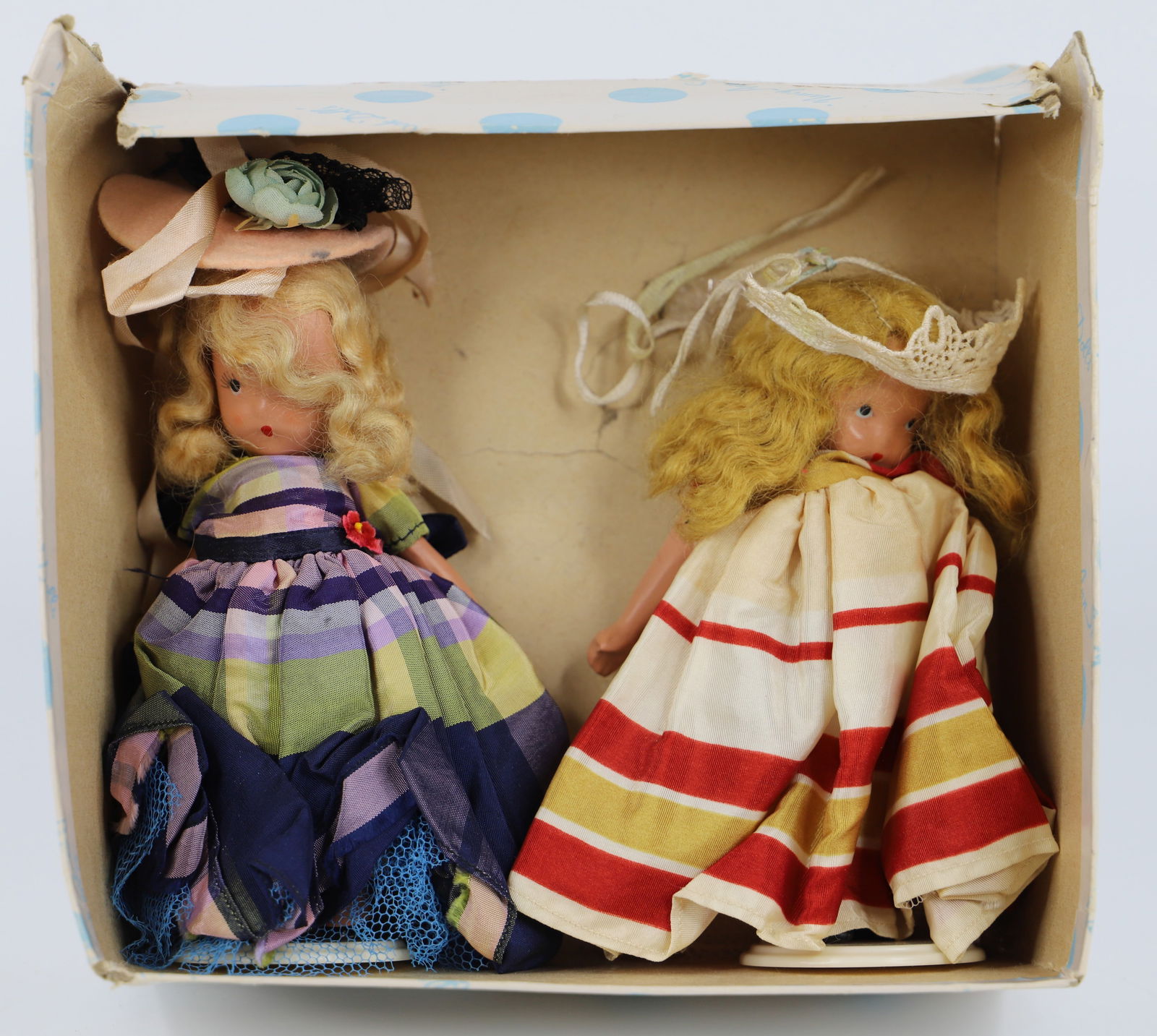 Nancy Ann Storybook Doll: Two dolls possibly from Fairyland Series "Cinderella Went to the Ball"; Number 155; Both are all bisque with stiff legs; They measure approximately H 5 inches; Doll with red dress is missing an arm an