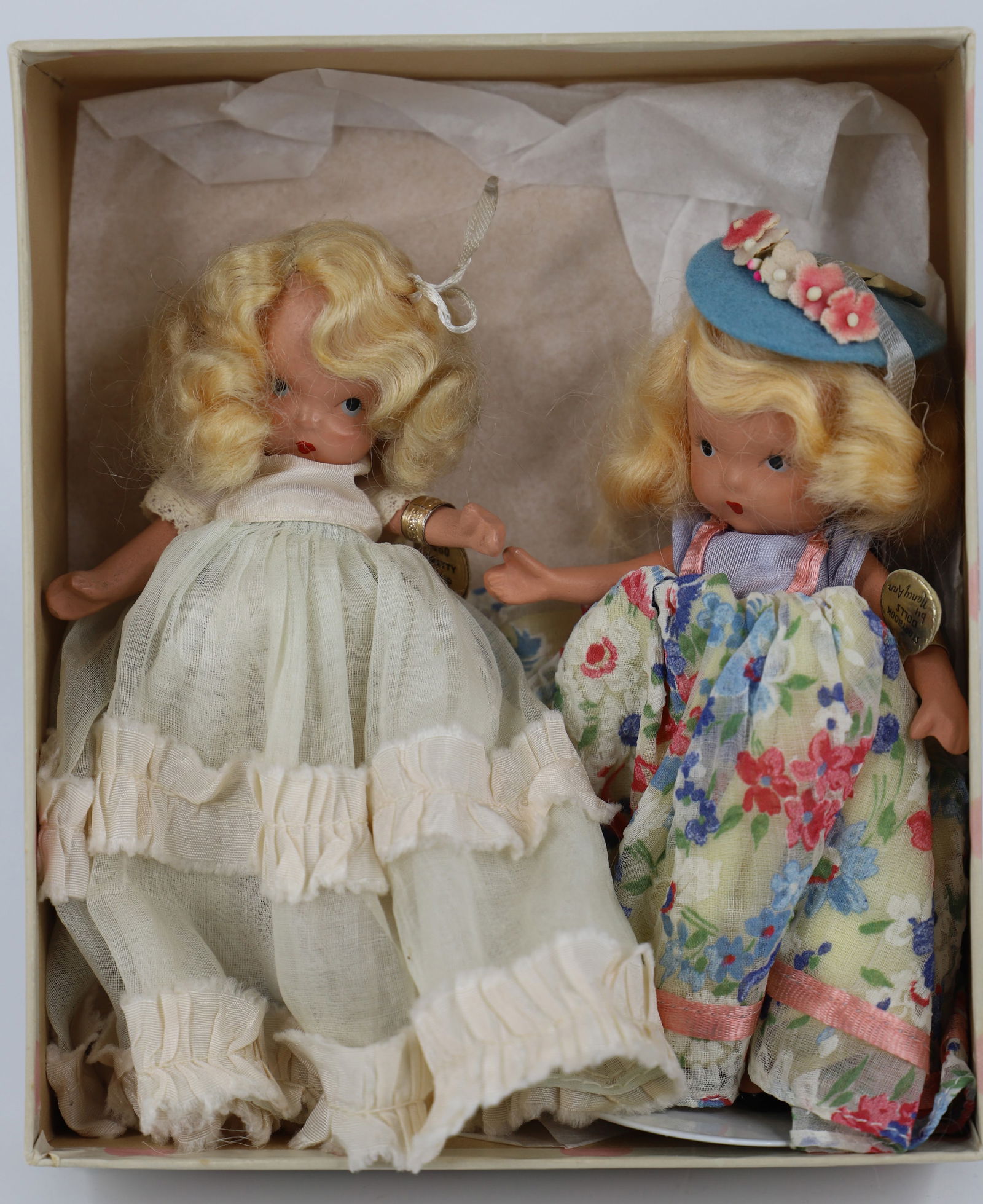 Nancy Ann Storybook Doll: Two dolls in a box marked "Pretty Maid-Pretty Maid Where have you Been"; Number 160; Bisque with painted faces; One has stiff legs; Both have gold arm tags; Tallest measures approximately H 5 1/2; No