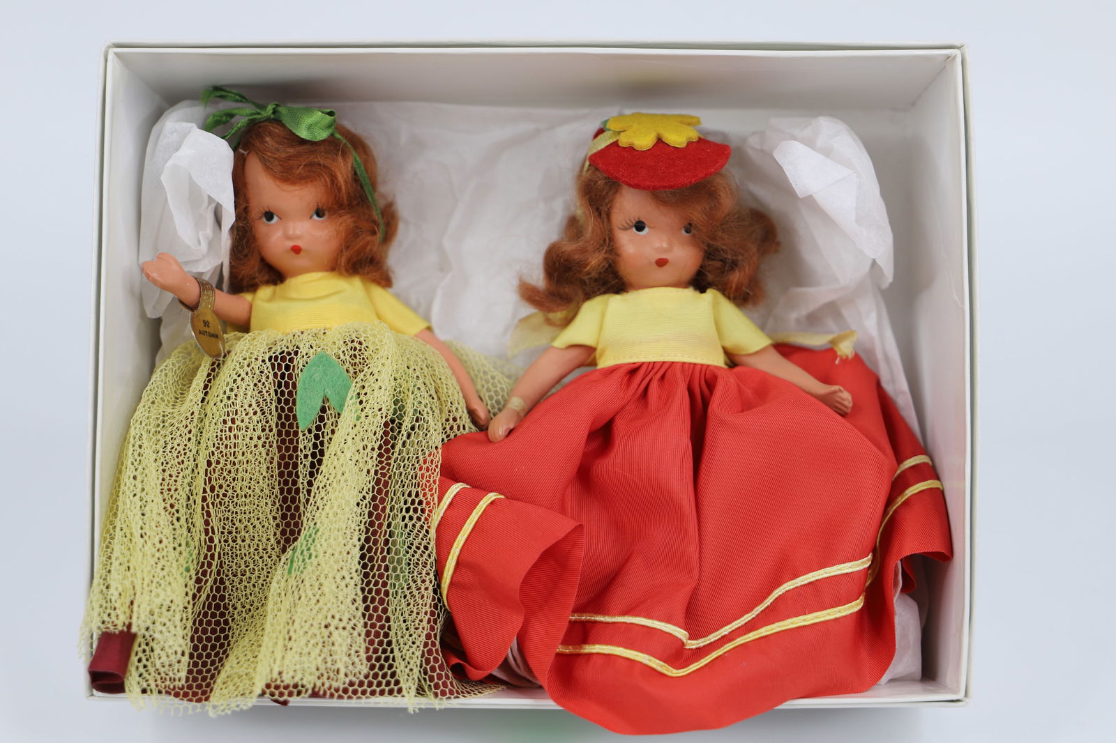 Nancy Ann Storybook Dolls: Two bisque dolls with stiff legs; Possibly "Autumn"; Each stands approximately H 5 1/4 inches; No damage observed. See photos