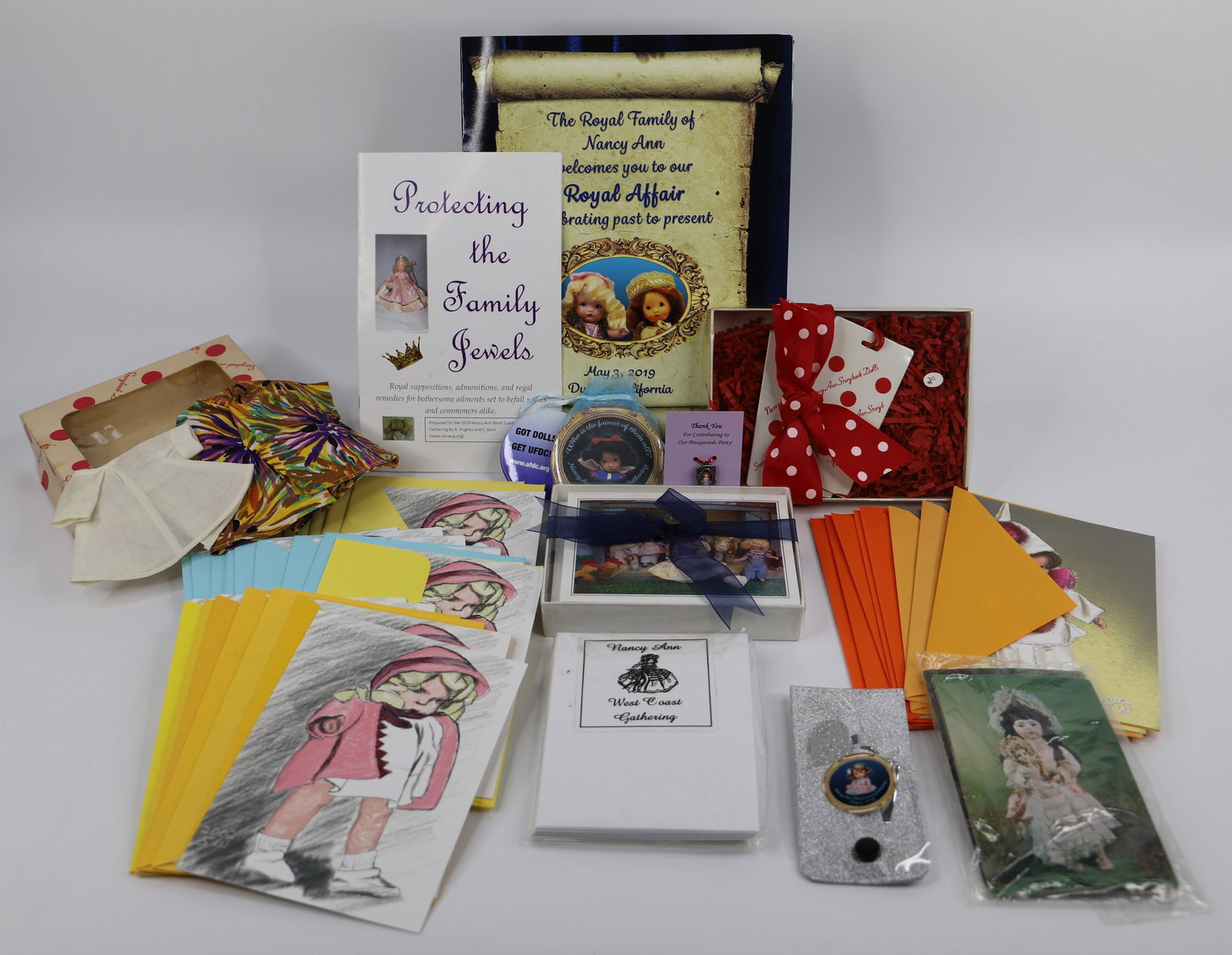 Nancy Ann Storybook Dolls, Clothes, Cards: Storybook Doll collection includes: two books, Wild Imagination greeting cards with envelopes, a charm, mirror, luggage tags and two articles of clothes; Mirror measures Diameter 3 inches; No damage o