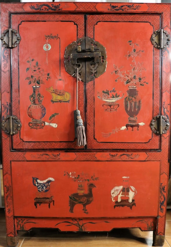 Red Lacquer Chest: Vintage Asian red lacquer chest with painted designs; Two doors with lock and secret bottom compartment; Measures approximately H 37 x W 25 x D 12 inches; Chips on edges; Wear commensurate with age. S