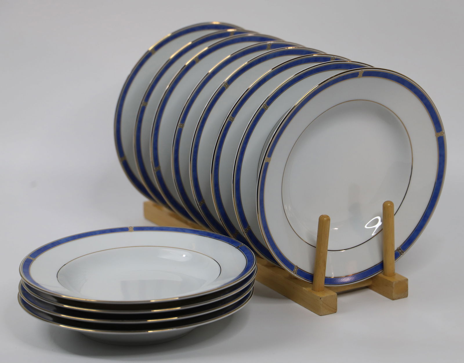 Christofle Porcelain, Rimmed Soup Bowls: Twelve bowls in the "Micro Gold Oceana Bleu" pattern; Each measures approximately Diameter 9 inches; No damage observed. See photos