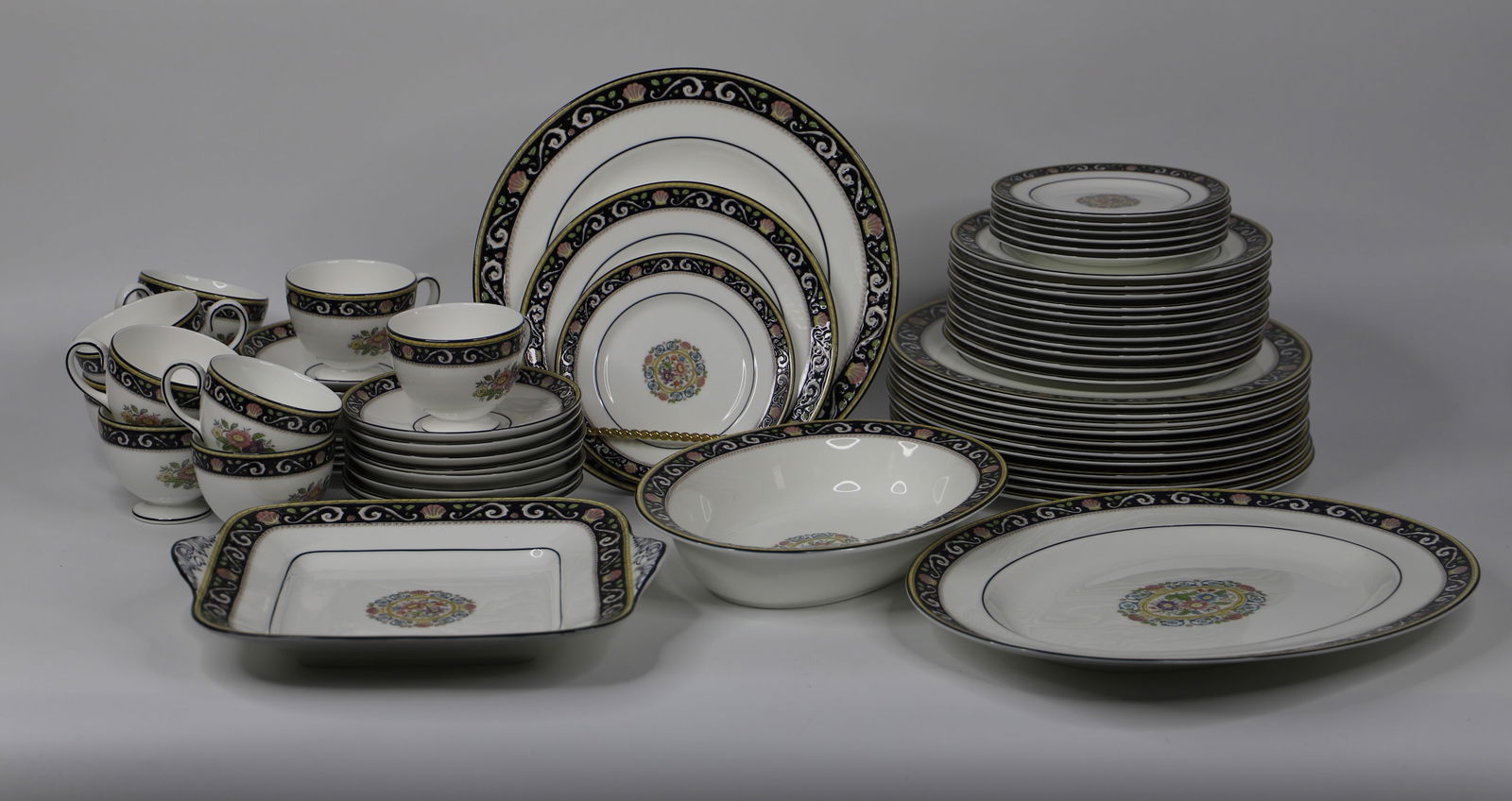 Wedgwood, Runnymede China: Sixty-one pieces of Runnymede dishes; Numbered W4472; Set includes 12 dinner plates; 12 salad plates, 12 bread/butter plates, 12 sauces, 10 teacups, 1 oval platter, 1 oval serving bowl, 1 square servi