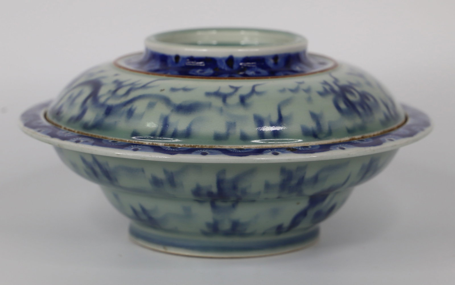 Chinese Porcelain Bowl: Antique bowl with lid; Possibly Qing Dynasty, circa 1880; No maker marks observed; Measures approximately H 5 x Diameter 10 inches; Discoloration on rims of bowl and lid; Tape residue on lid; See phot