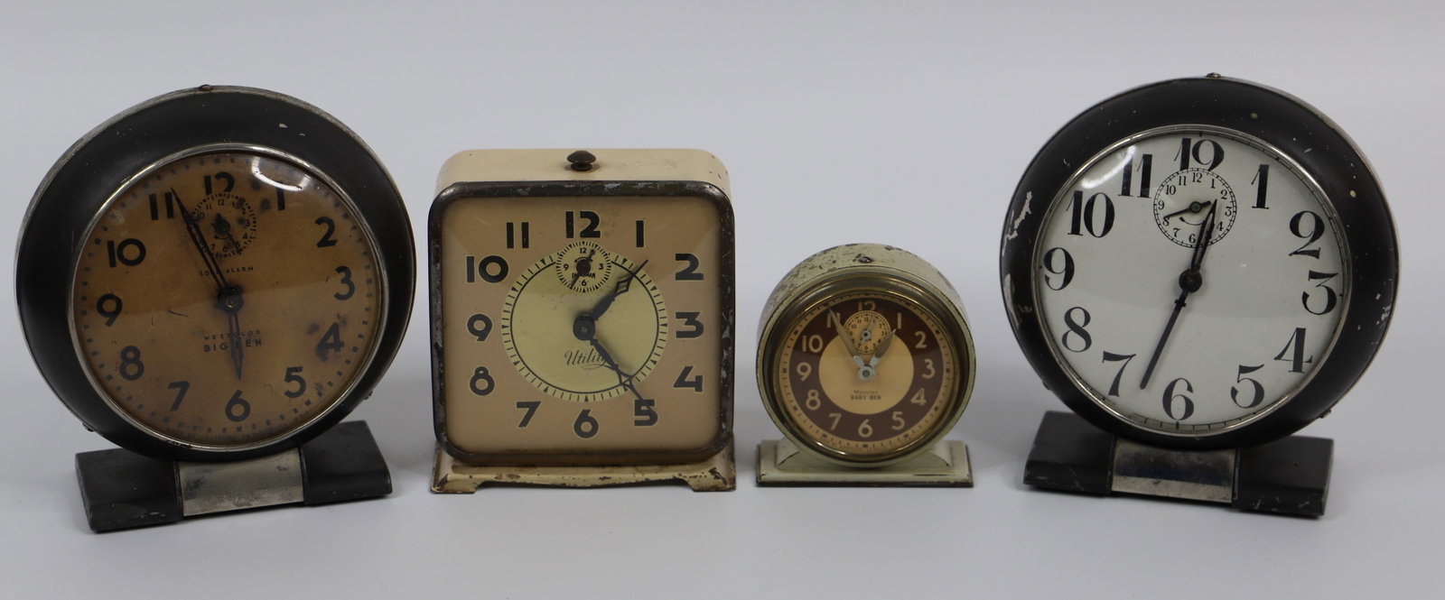 Westclox, Ingraham, Alarm Clocks: Four vintage alarm clocks; Westclox Baby Ben and Big Ben clocks; Black clock with white face has no visible maker marks; Ingraham "Utility" clock measures approximately H 4 3/4 x W 4 x D 2 inches; Vis