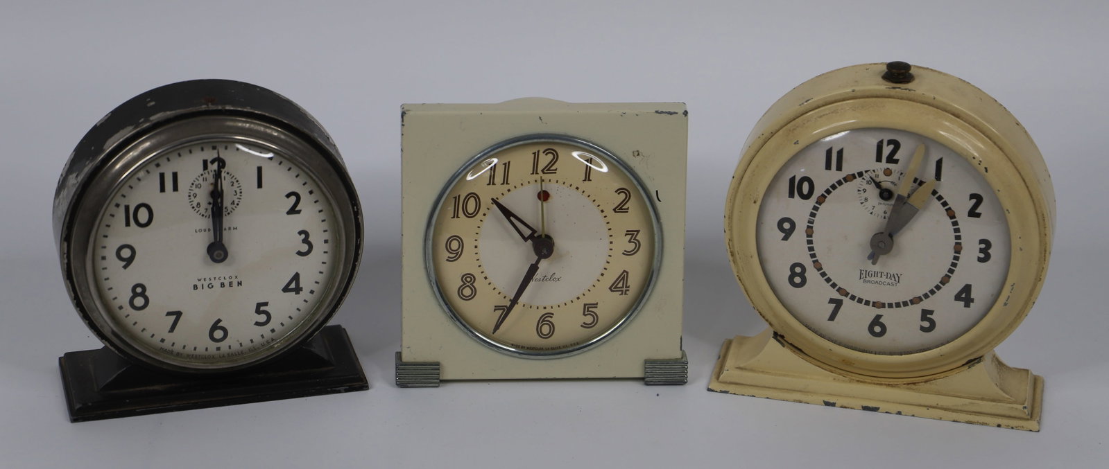 Westclox, Ingraham, Alarm Clocks: Three vintage alarm clocks; Westclox Big Ben; White Westclox has no visible marks; Ingraham Eight-Day Broadcast measures approximately H 6 x W 6 x D 2 inches; Visible scratches and damage; Working con