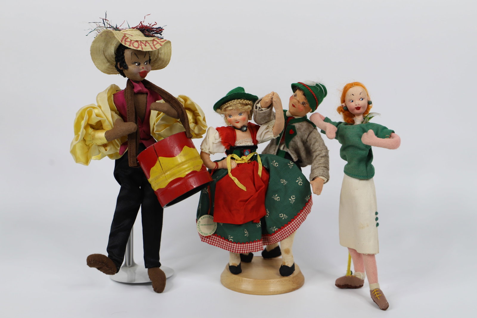 Garmisch Andexer, Klumpa, Foreign Dolls: Garmisch Andexer dancing dolls on pedestal; Klumpa/Klumpe puppet woman; Drummer doll; Dancing dolls measure approximately H 9 1/2 x W 6 x D 4 inches; Age appropriate condition of all, stains in areas 