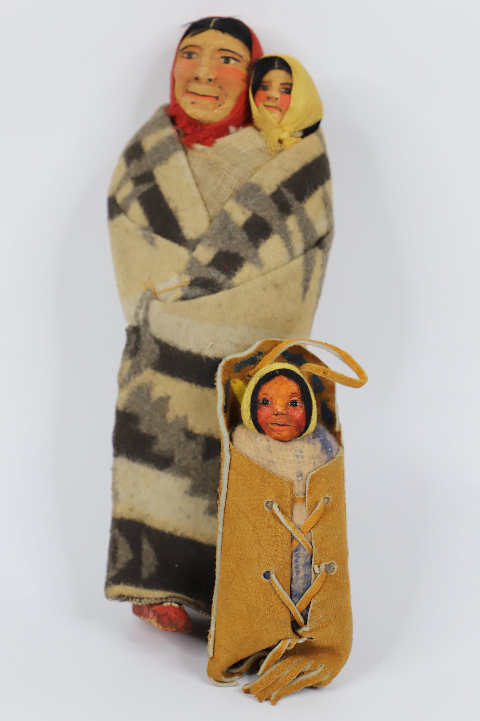Mary Frances Woods, Native American Dolls: Two unmarked, Native American Skookum dolls in the style Mary Frances Woods; Tallest measures approximately H 12 x W 5 x D 2 1/2 inches; Age appropriate condition, visible scuffing on the face of the 