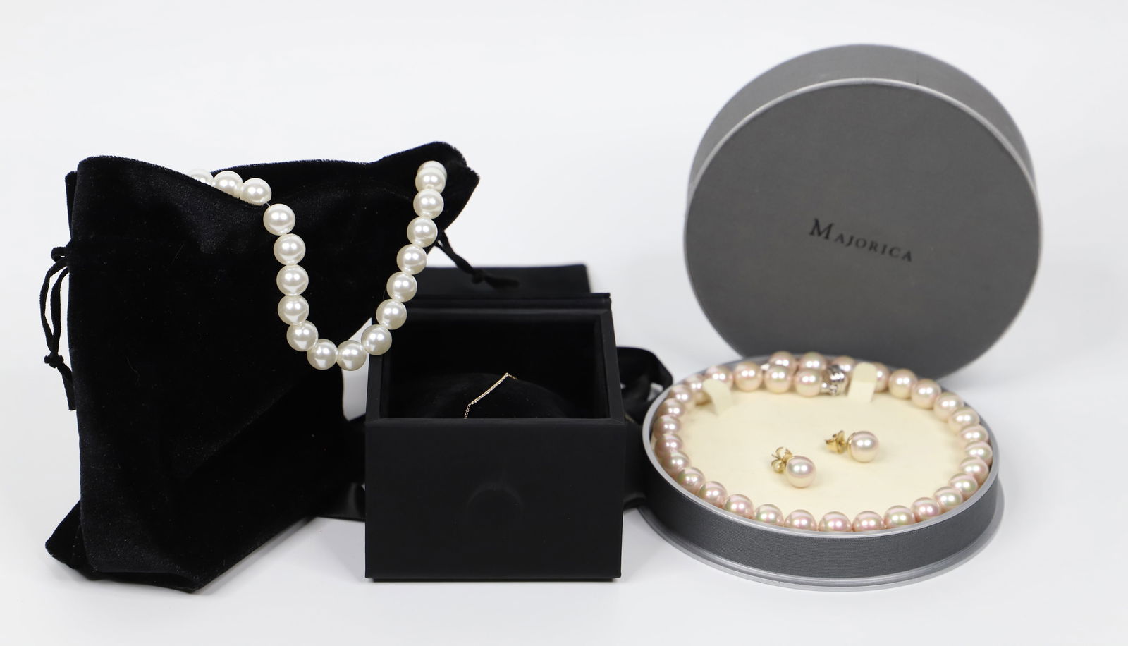 Majorica, Ring Concierge, Jewelry: Majorica pearl necklace and earrings; Sterling silver parts on both necklace and earrings marked 925; Ring Concierge 14K gold bracelet; Stones in bracelet are possibly diamonds; Necklace measures appr