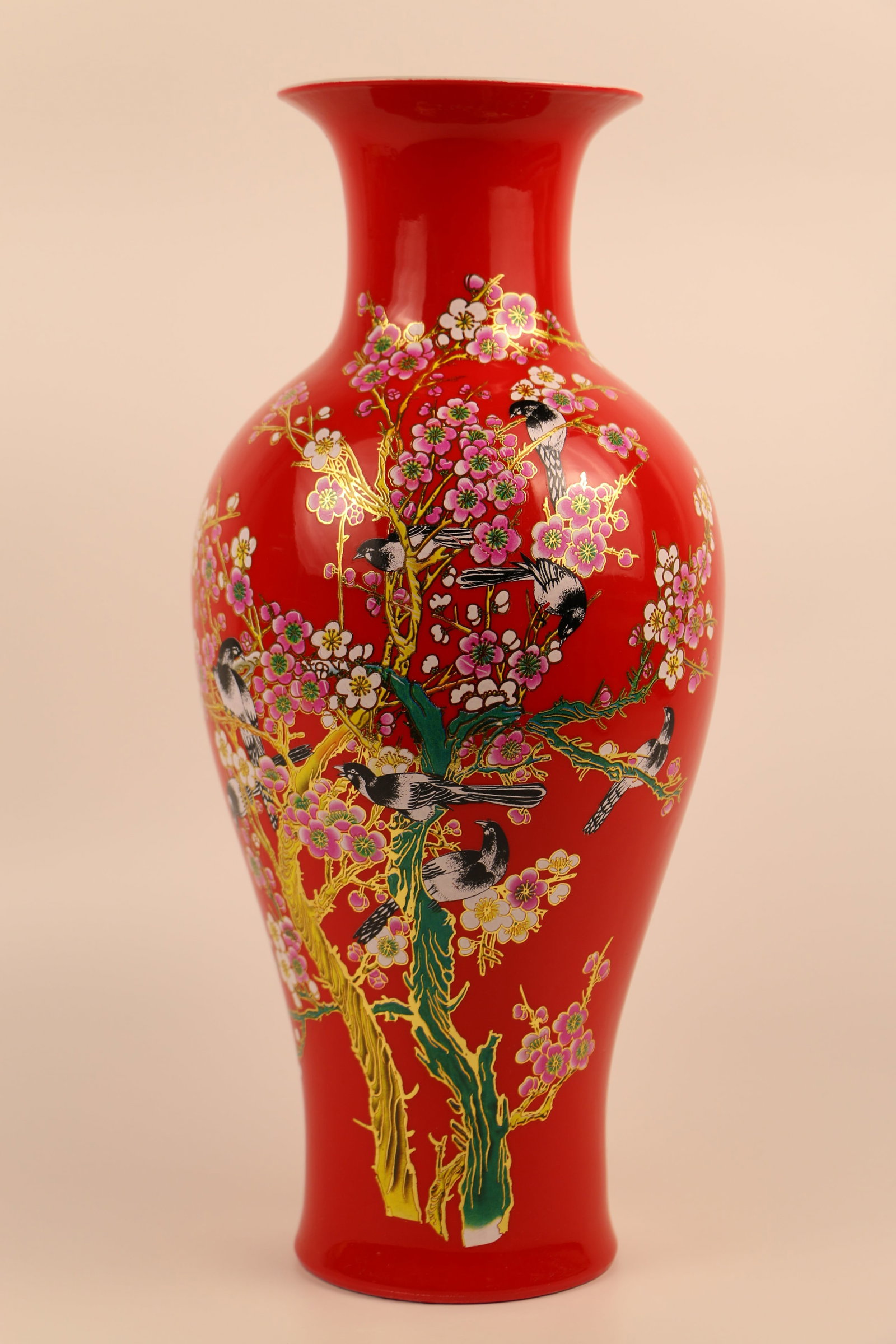Porcelain Vase: Red porcelain vase with transferware birds and cherry blossoms; Unknown mark on the base; Measures approximately H 15 x Diameter 7 inches; Light scratching on the transfers. See photos