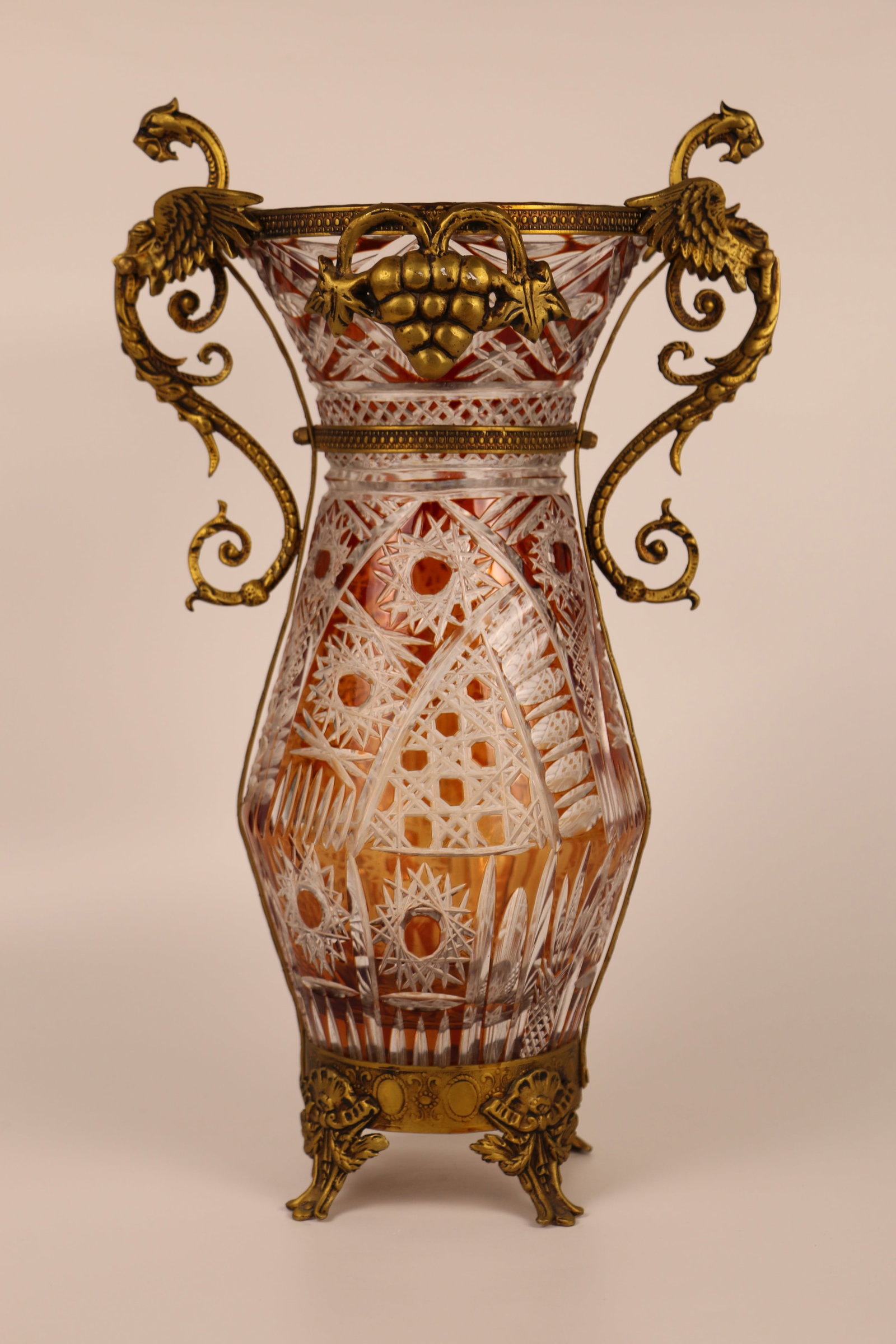 Cut Crystal, Bronze Vase: Cut to clear crystal vase in an amber/light brown color; Possibly bronze base and dragon handles; No maker marks observed; Measures approximately H 16 x W 10 x D 6 inches; Wear commensurate with age. 