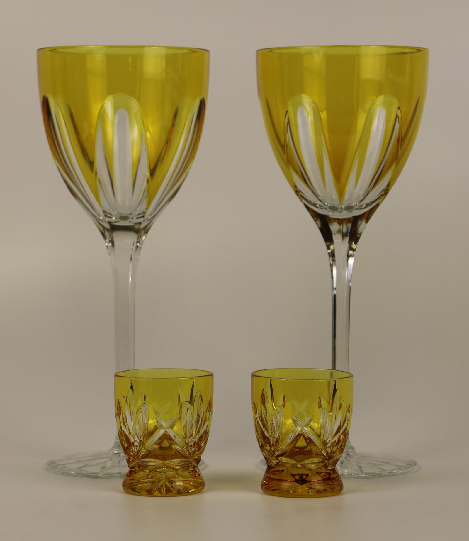 Faberge, Crystal Glasses: Two Faberge crystal wine glasses; Two Faberge cordial/liqueur glasses; All glasses are marked "Faberge"; Wine glasses measure approximately H 9 x Diameter 3 3/4 inches; No damage observed. See photos
