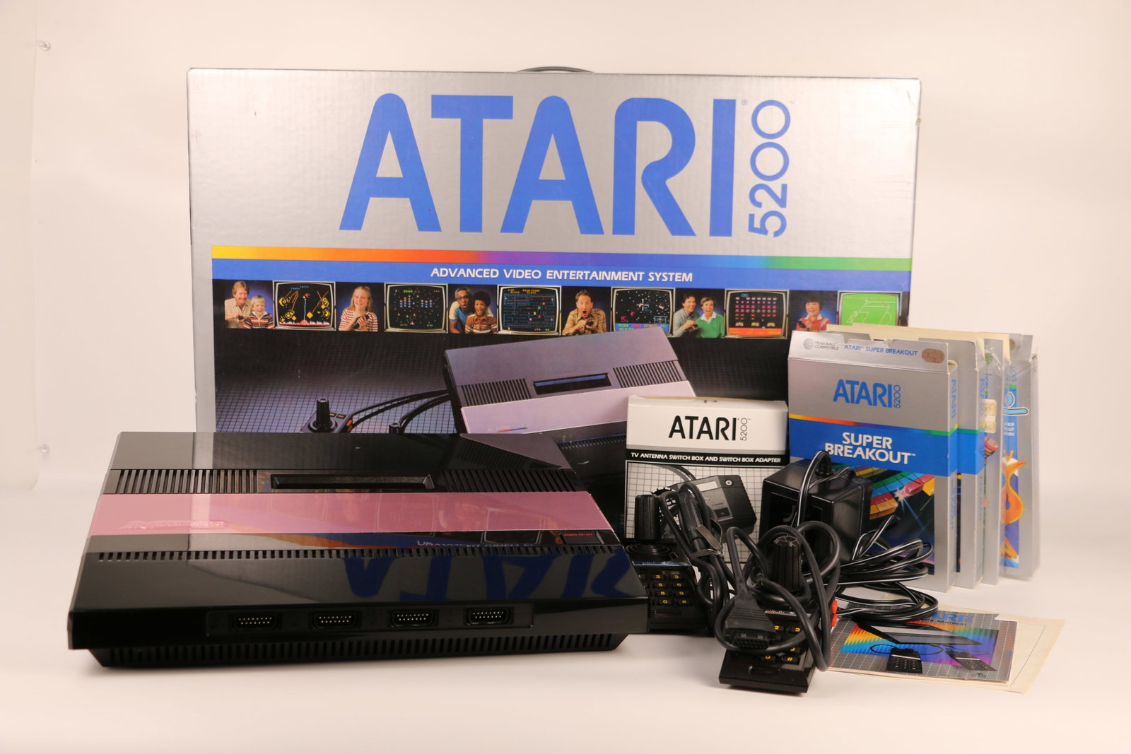 Atari 5200, Advanced Video Entertainment System: Atari game console with two controllers and cables; Four games are included: Pac-Man, Jungle Hunt, Kangaroo and Super Breakout; Box is dated 1982; Box measures approximately H 16 x W 15 1/2 x D 6 1/2 