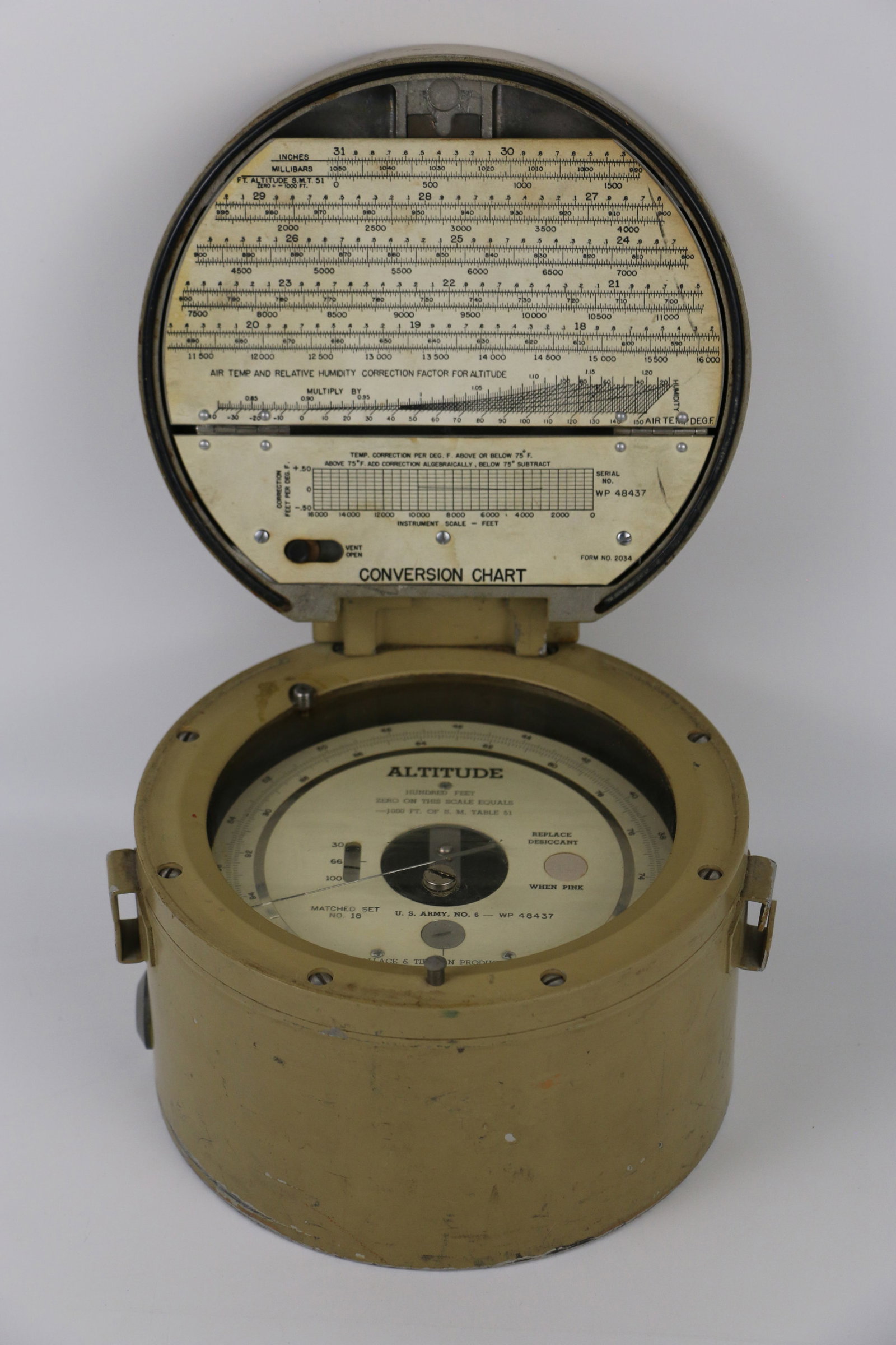 Wallace & Tiernan Products, Altimeter: Vintage altimeter housed in a metal case; Marked "US Army, No. 6-WP 48437; Working condition unknown; Case measures approximately H 5 x Diameter 7 inches; Outer case is scratched, discolored and has t