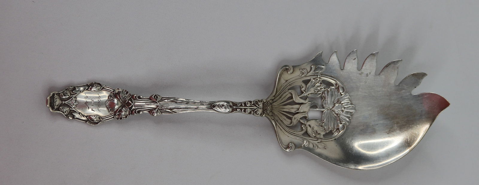 Gorham, Sterling Macaroni Spoon: One sterling silver macaroni spoon by Gorham in the "Virginiana" pattern dated 1904; Monogram "M" on handle; British marks on back; Approximate Length 9 x W 2 1/2 inches in bowl: Weighs approximately