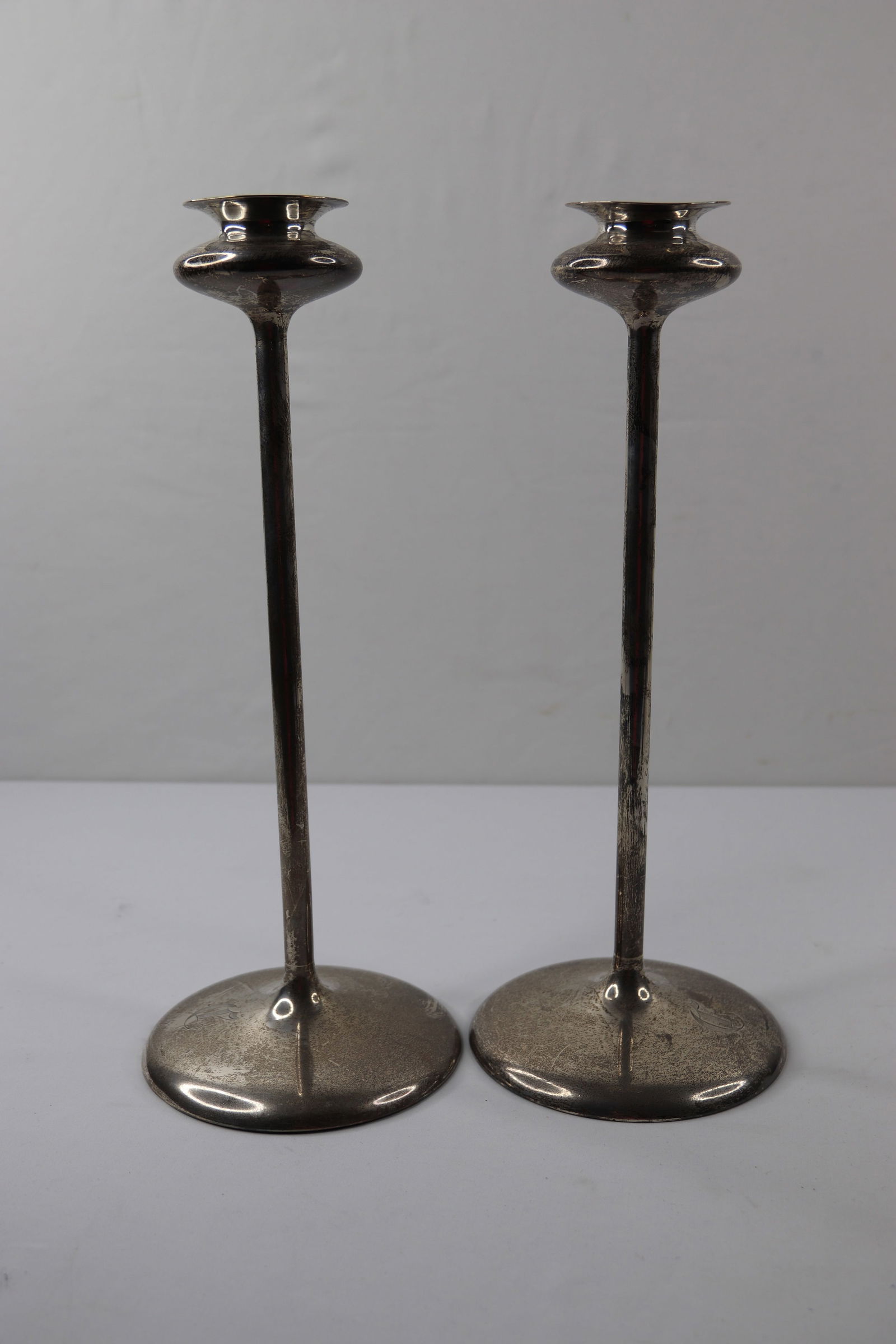 Sterling Silver Candlesticks: Two tall matching candlesticks marked sterling; No maker marks observed; Monogram "C" on both; Total weight 15.920 troy ounces; Measure approximately H 12 1/2 inches; Preowned/used condition; No damag