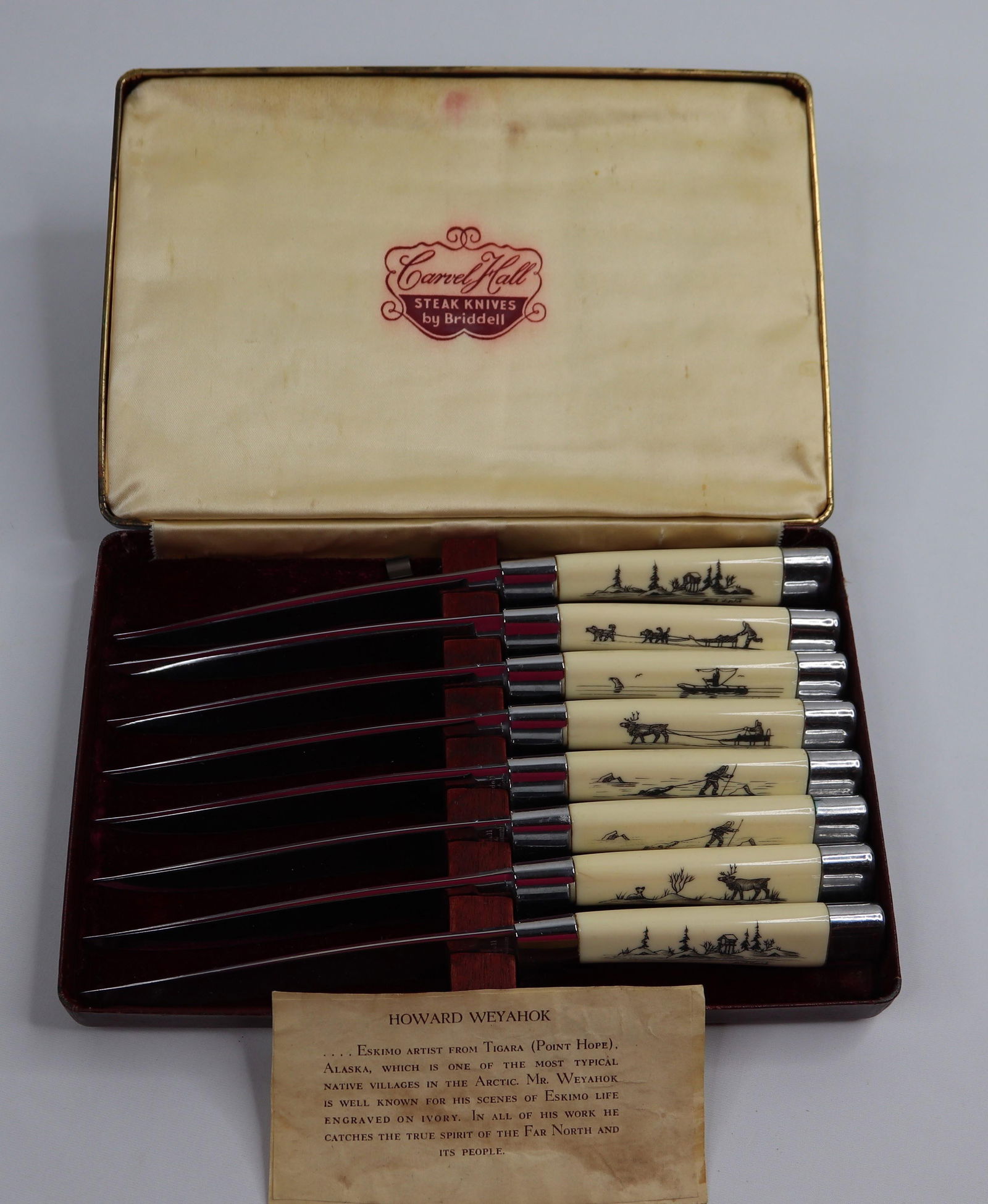 Howard Weyahok, Steak Knives: Eight steak knives with bone handles, carved by Howard Weyahok in Alaska; Pattern is "CHIO" with original presentation case by Carvel Hall, Bridell; Case measures approximately H 1 1/2 x W 8 1/2 x D 5