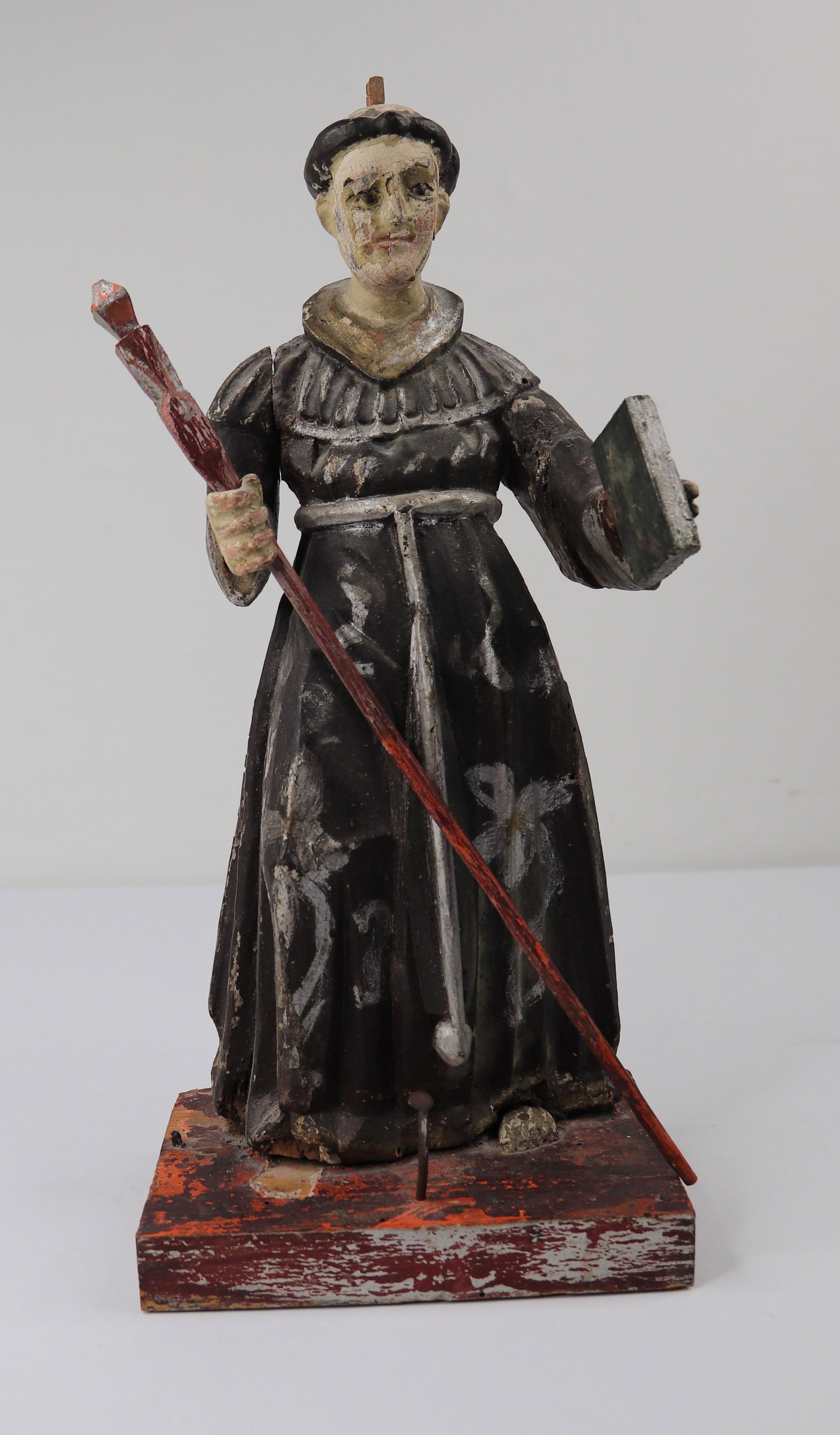 Painted Wooden Religious Figure: Carved and painted wooden religious figure, possibly Saint Anthony; No marks observed; Measures approximately H 14 x W 6 x D 4 inches; Item in vintage condition with damage; Paint loss all over, right