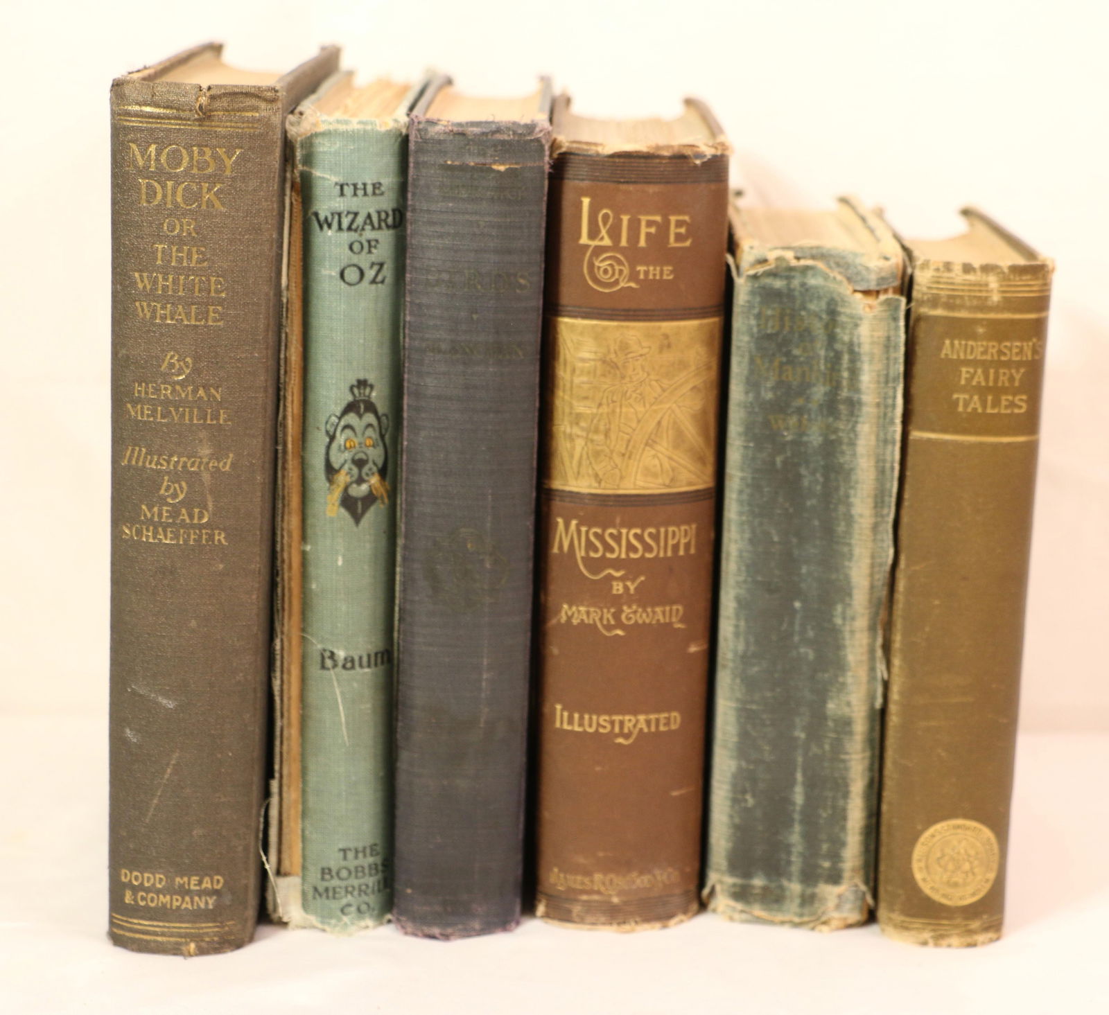 Antique Books: Six antique books; "Life on the Mississippi" by Mark Twain dated 1883; "Moby Dick or White Whale" by Herman Melville dated 1923; "The Wizard of Oz" by Frank Baum dated 1903; "The Nature Library Birds"