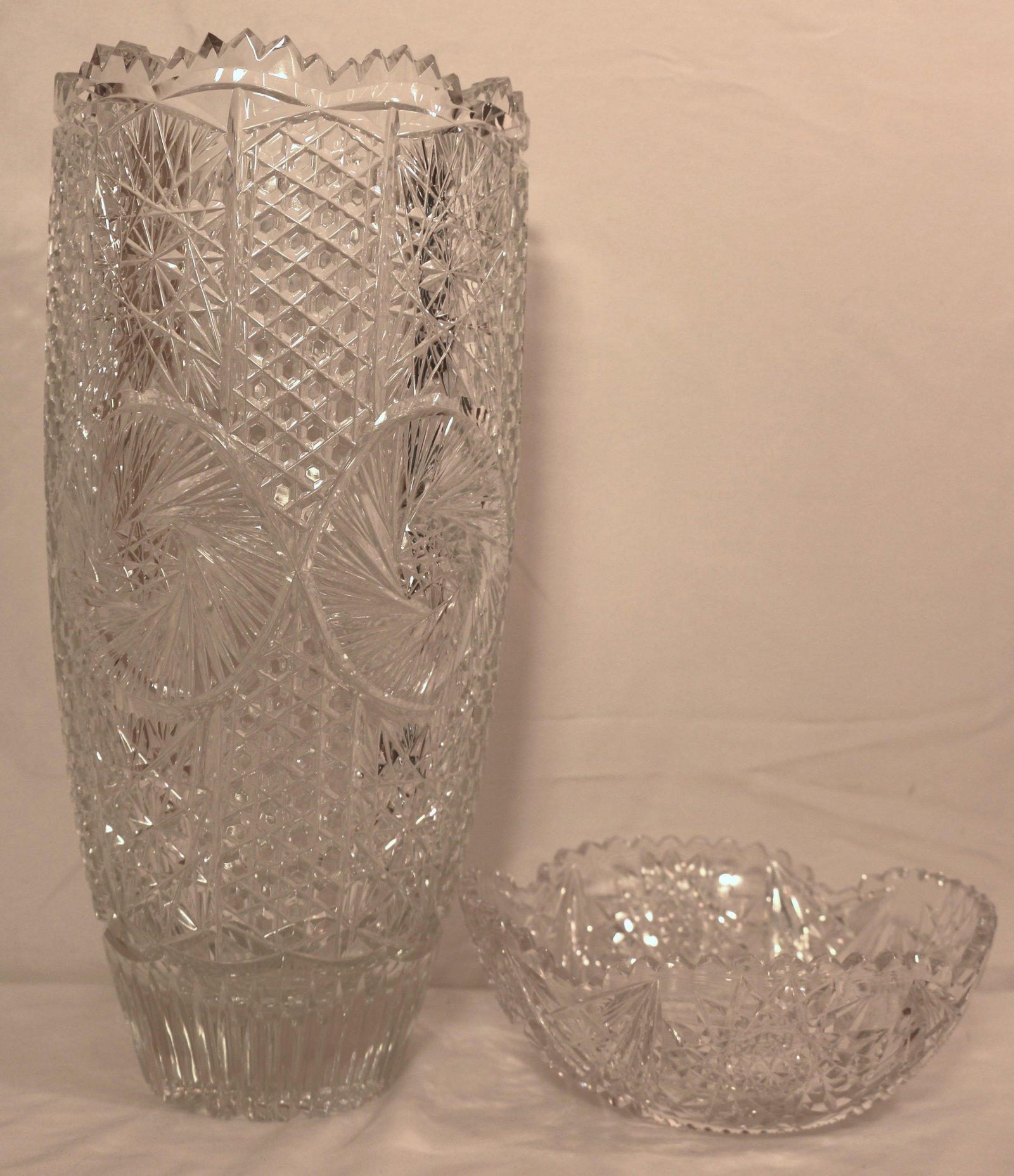 Brilliant Cut Vase, Bowl: Large Brilliant cut vase and bowl in different patterns; No maker marks observed; Vase measures approximately H 15 x Diameter 7 inches; Small chip on rim of bowl; See photos. Pick up in Longmont CO