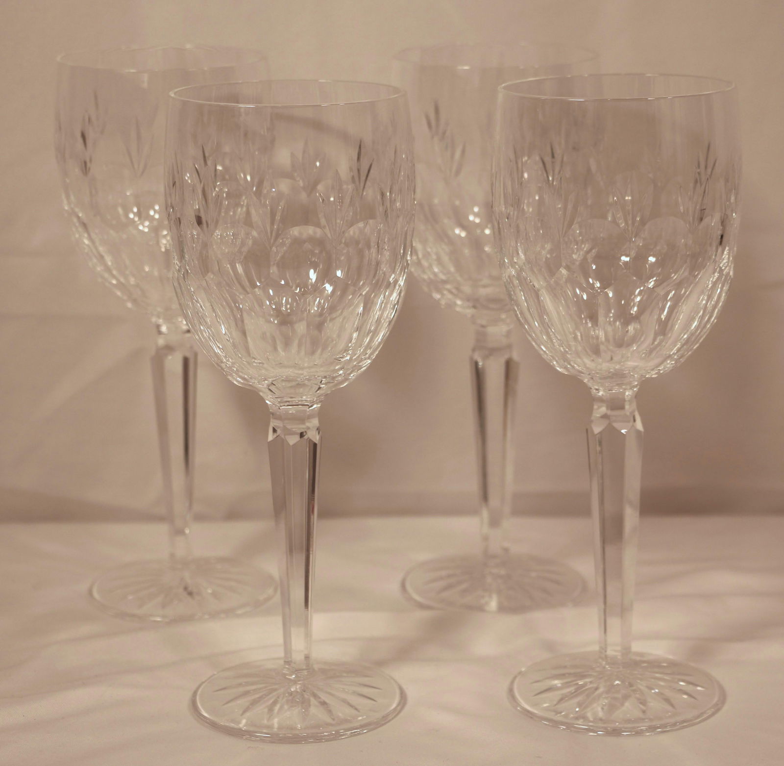 Waterford Crystal, Wine Glasses: Four crystal wine glasses, all marked "Waterford"; Each measures approximately H 8 1/2 x Diameter 3 inches; No damage observed; See photos. Pick up in Longmont CO