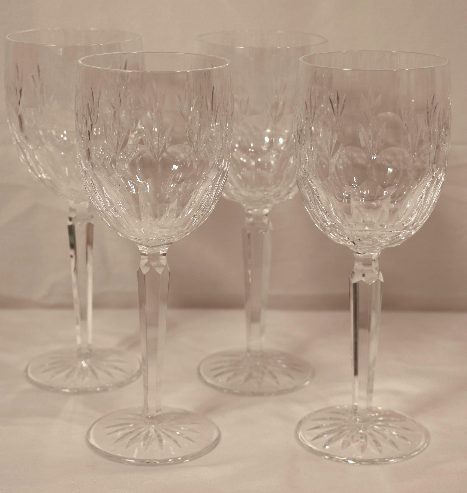 Waterford Crystal, Wine Glasses: Four crystal wine glasses, all marked "Waterford"; Each measures approximately H 8 1/2 x Diameter 3 inches; No damage observed; See photos. Pick up in Longmont CO