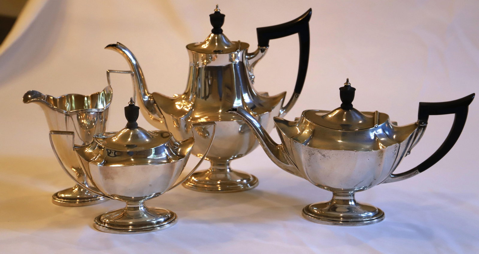 Sterling Silver Tea Set: Water pot, tea pot, cream and sugar; All are marked "Sterling"; Total weight is approximately 46.885 troy ounces; In used condition, tarnishing; See photos. Pick up in Longmont