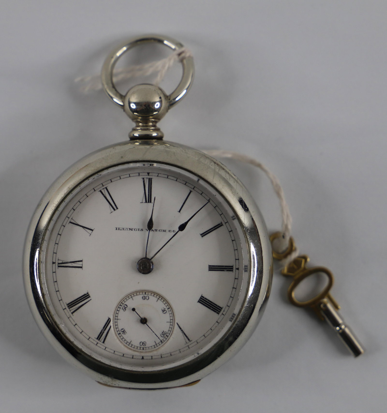 Illinois Watch Co., Vintage Pocket Watch: Vintage pocket watch by the Illinois Watch Company number 484660; Key is present; Measures approximately Diameter 2 1/4 inches; Preowned item with wear commensurate with age; Working condition unknown