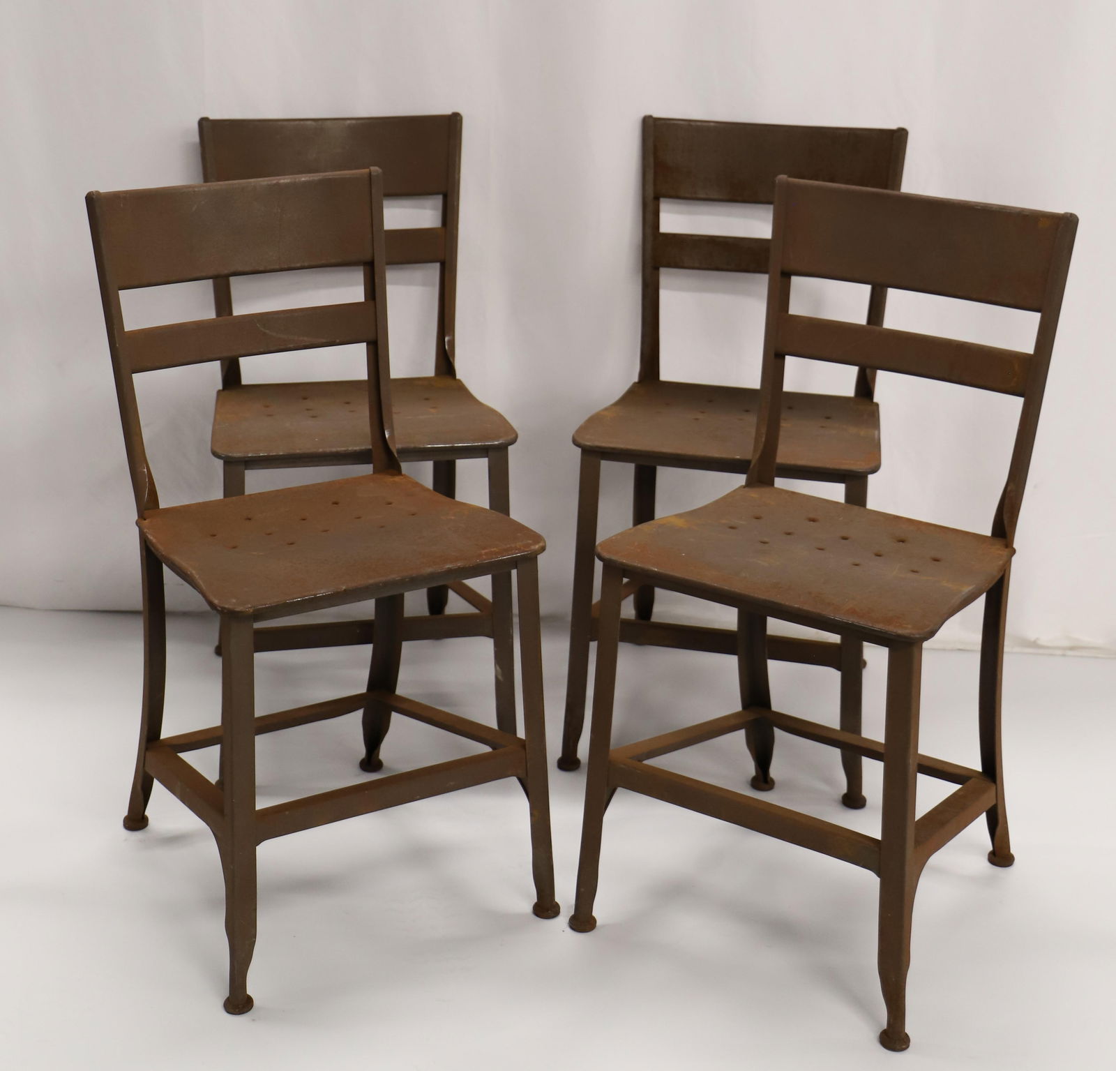 Toledo, Vintage MCM Steele Dining Chairs: Set of four steele vintage MCM dining chairs by "Toledo"; Vintage Mid-Century Toledo Steel Dining ChairIconic lines;Perforated steel Toledo vintage industrial dining / side chair with original finish;