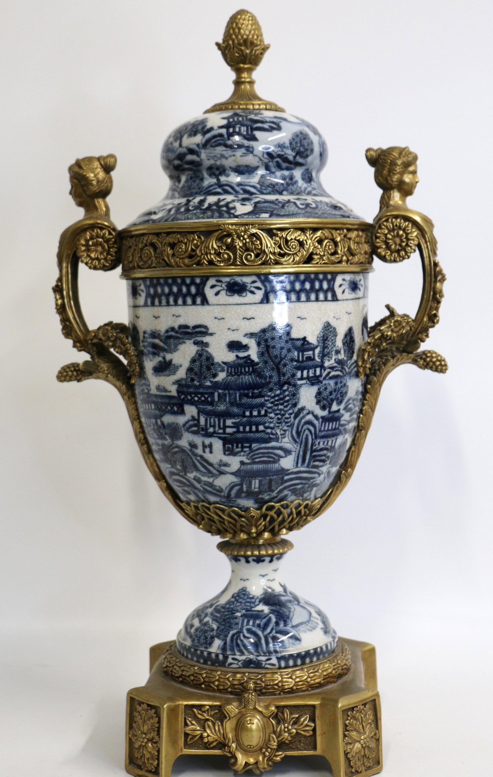 Porcelain, Cast Metal, Urn: Antique blue and white porcelain urn with a crackle finish, cast metal mount and handles; Unknown maker mark, dated 1897; Measures approximately H 25 x W 12 x D 8 1/2 inches; Preowned, wear commensura