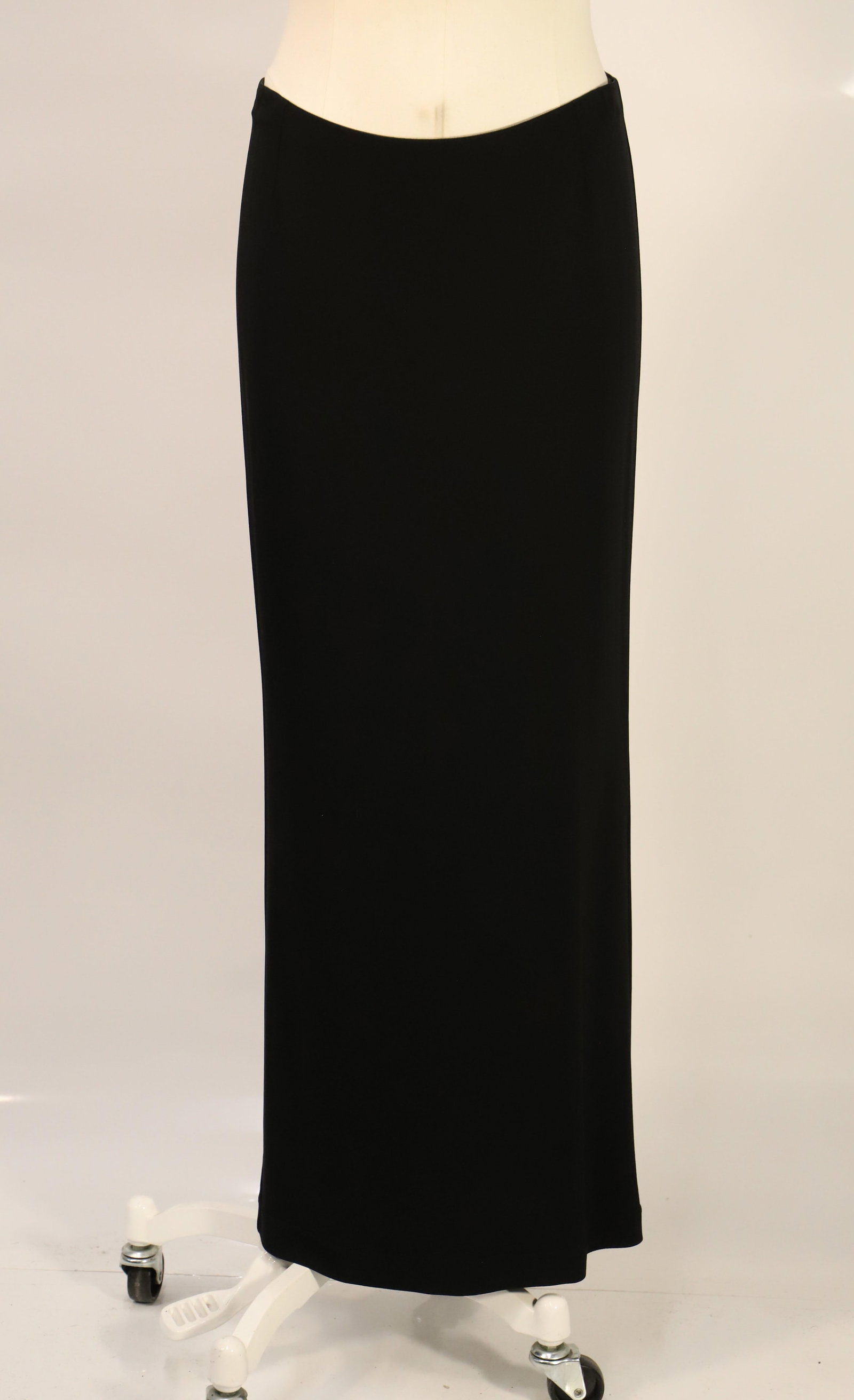 Dolce & Gabbana, Skirt: Ladies black straight skirt zipper closure; Fabric is rayon and Spandex; Size 44, length is approximately 38 inches; Preowned, dirt on the hem. See photos (Please note, this item has not been authenti