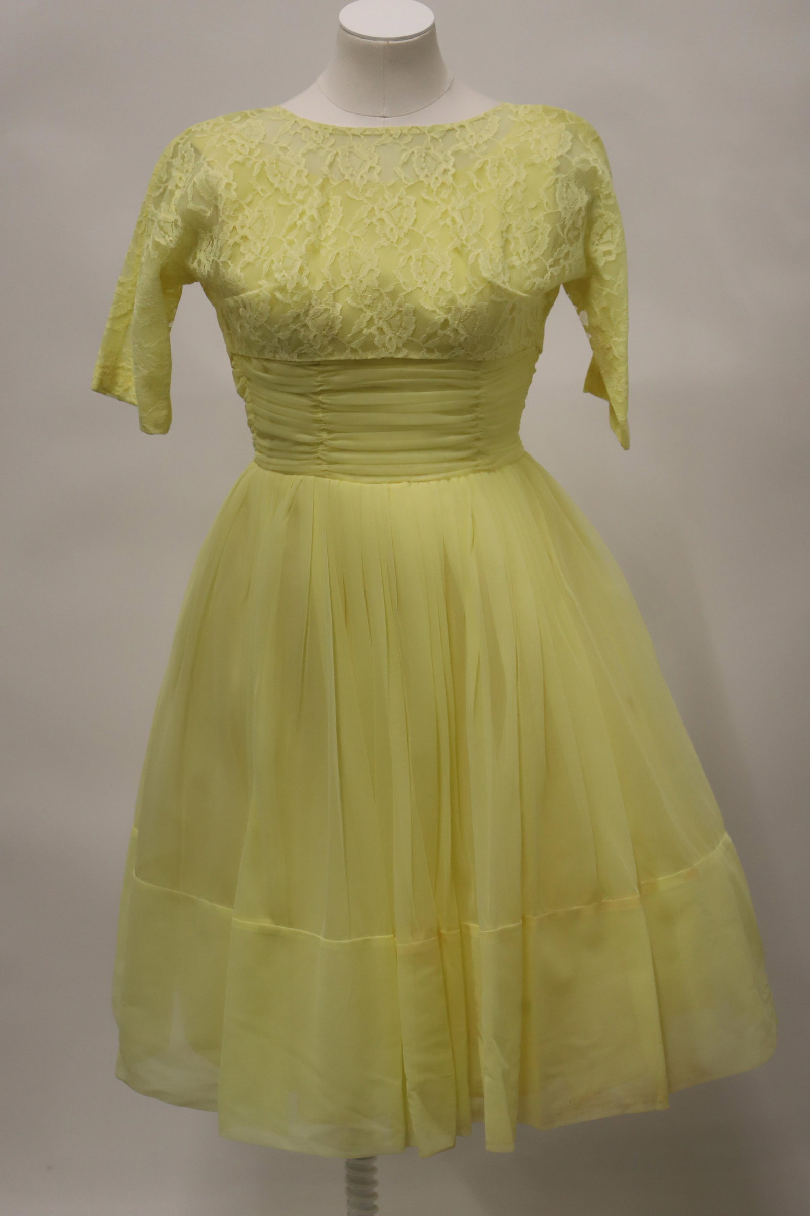 Vintage Ladies Dress: Tulle and chiffon, handmade dress with lace bolero style jacket that buttons on the back; No maker mark or size observed; Chest measures approximately 32 inches, waist measures approximately 24 inches