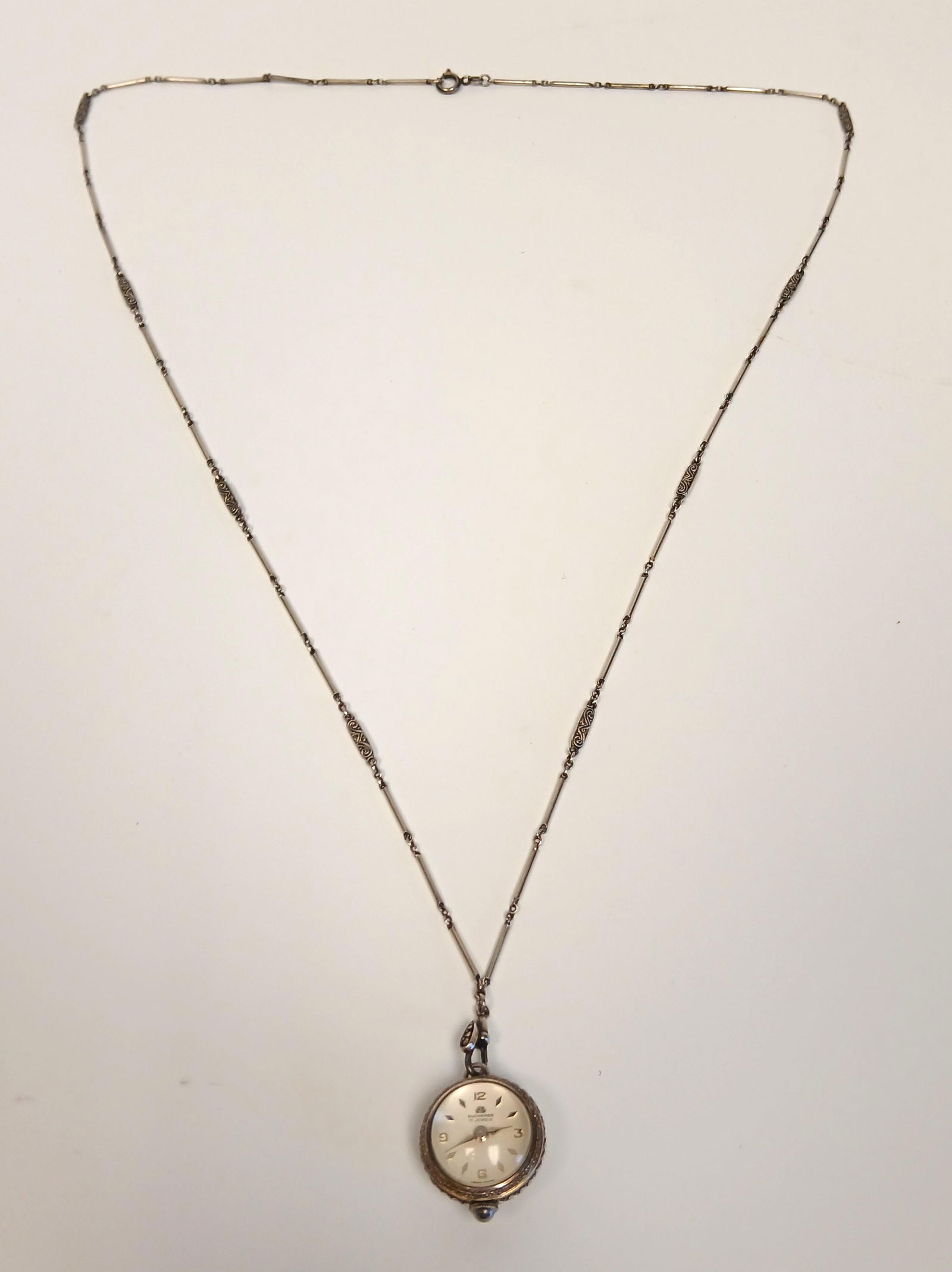 Bucherer, Silver Bubble Pendant Watch: One vintage bubble pendant watch with 800 silver chain; Made by "Bucherer"; Chain is marked "800"; Chain is approximately 28 inches in length; Pendant measures approximately 3/4 inch in diameter; Watc