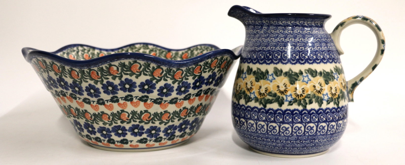 Boles?awiec, Polish Pottery: Large pottery bowl and jug in different patterns; Both are marked "Handmade in Poland" Bowl measures approximately H 5 1/4 x Diameter 12 inches; Preowned, no damage observed. See photos