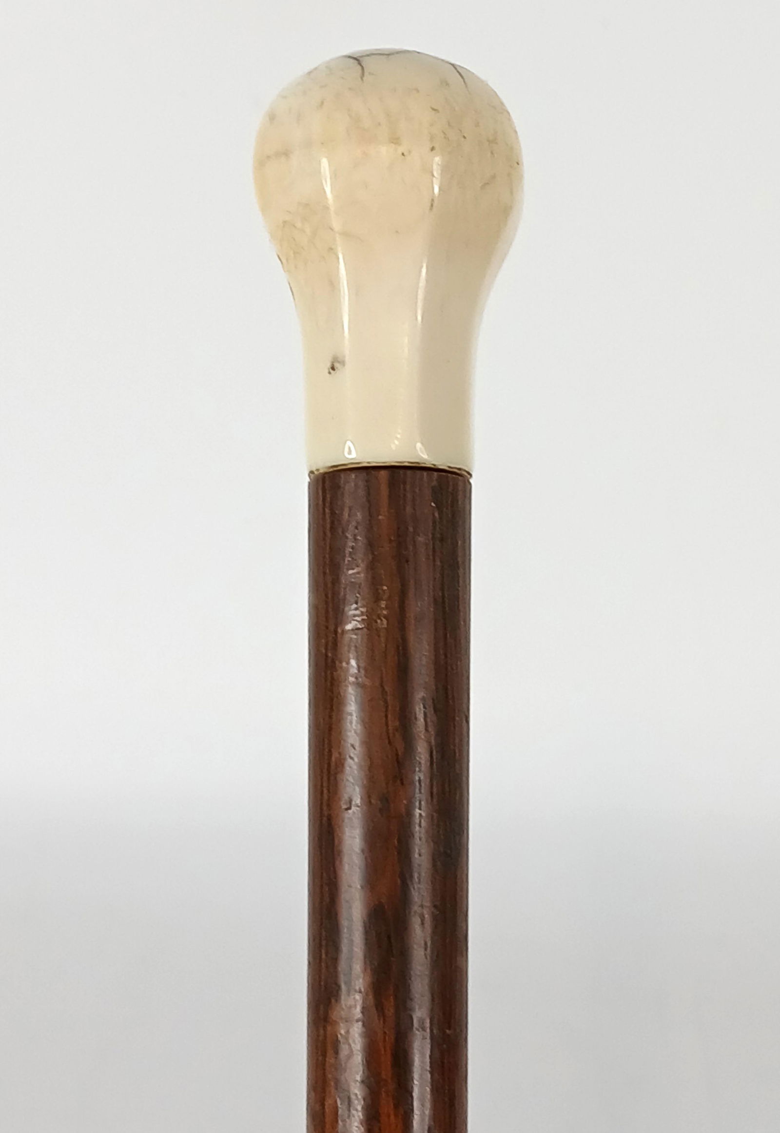 Bone Handle Cane: Victorian era cane (c) 1860-1900; Bone handle, no collar, wood shaft, missing ferrule; No maker marks observed; Measures approximately H 33 1/2 inches; Wear commensurate with age. See photos