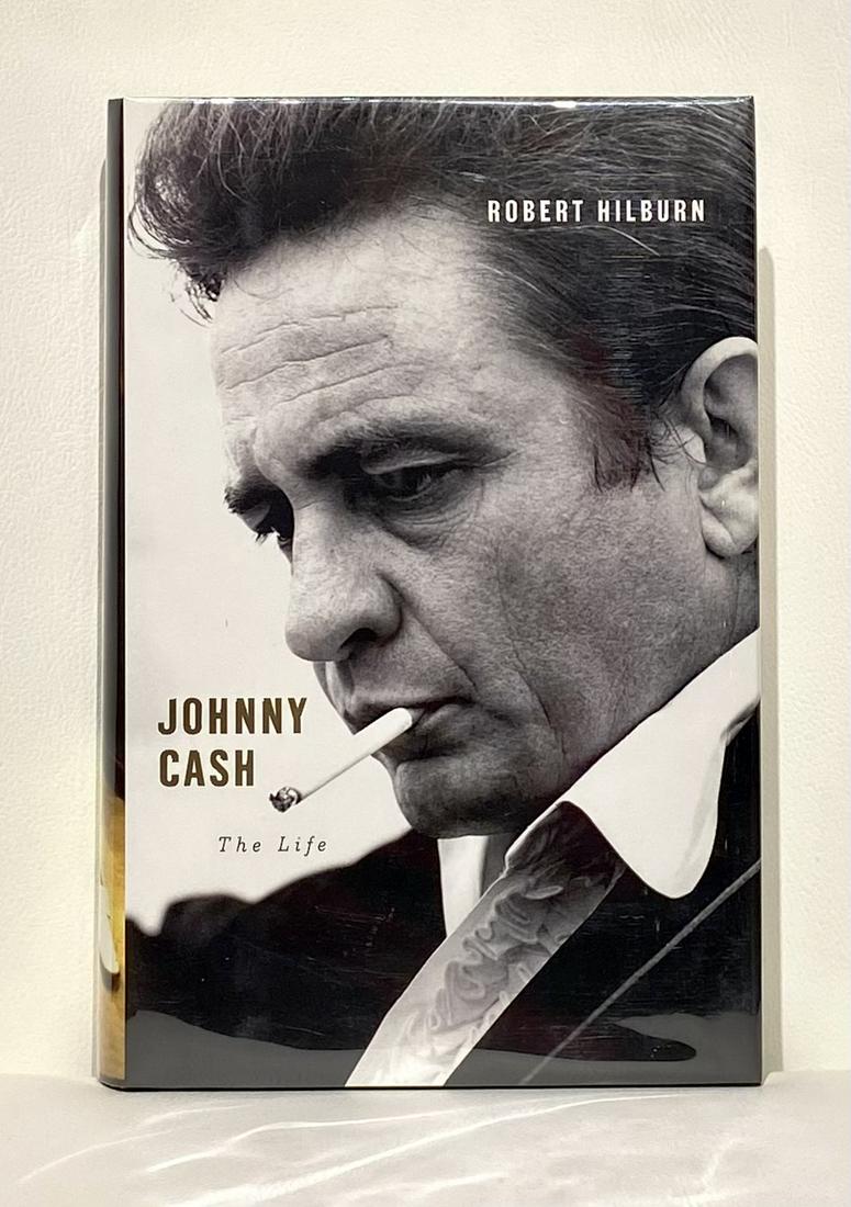 Robert Hilburn "Johnny Cash - The Life" Signed Book: Artist: Robert Hilburn Title: Johnny Cash "The Life" Medium: Book Art Dimensions: 9.5 H x 6.5 W inches Item Description: Released in 2013, Hilburnâ€™s thorough and intimate look at th