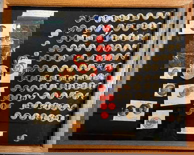 Early 1900's Cigarette Pins, Military Buttons and Other Memorabilia: Artist: Unknown Title: Early 1900's Cigarette Pins, Military Buttons and Other Memorabilia Medium: Display Case Art Dimensions: 18 H x 22 W x 2 D inches Framed Dimensions: 18 H x 22 W