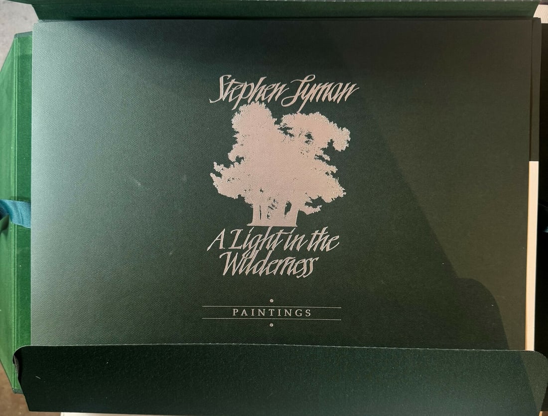 Stephen Lyman "A Light in the Wilderness" Limited Edition Unopened Hard Bound Book w/Signed Cover: Artist: Stephen Lyman Title: Stephen Lyman "A Light in the Wilderness" Limited Edition Unopened Hard Bound Book w/Signed Cover Medium: Hard Bound Book Limited Edition: Art Dimensions: ART