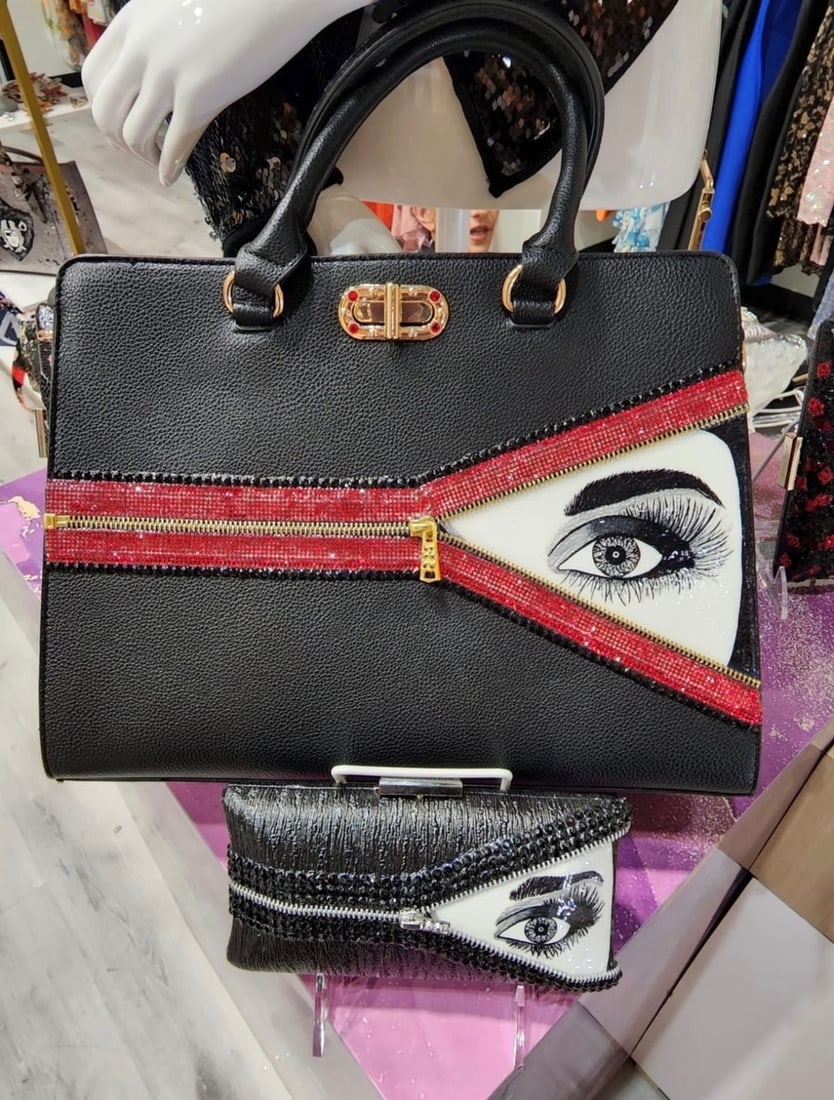 Mercedes Brunelli "Unzipped" Tote Crossbody Shoulder Bag, Hand Painted Eye Embellished with: Artist: Mercedes Brunelli Title: Mercedes Brunelli "Unzipped" Tote Crossbody Shoulder Bag, Hand Painted Eye Embellished with Swarovski Crystal Zipper Art Dimensions: 10 x 14.2 x 6 inch ARTIST BIO: Mer