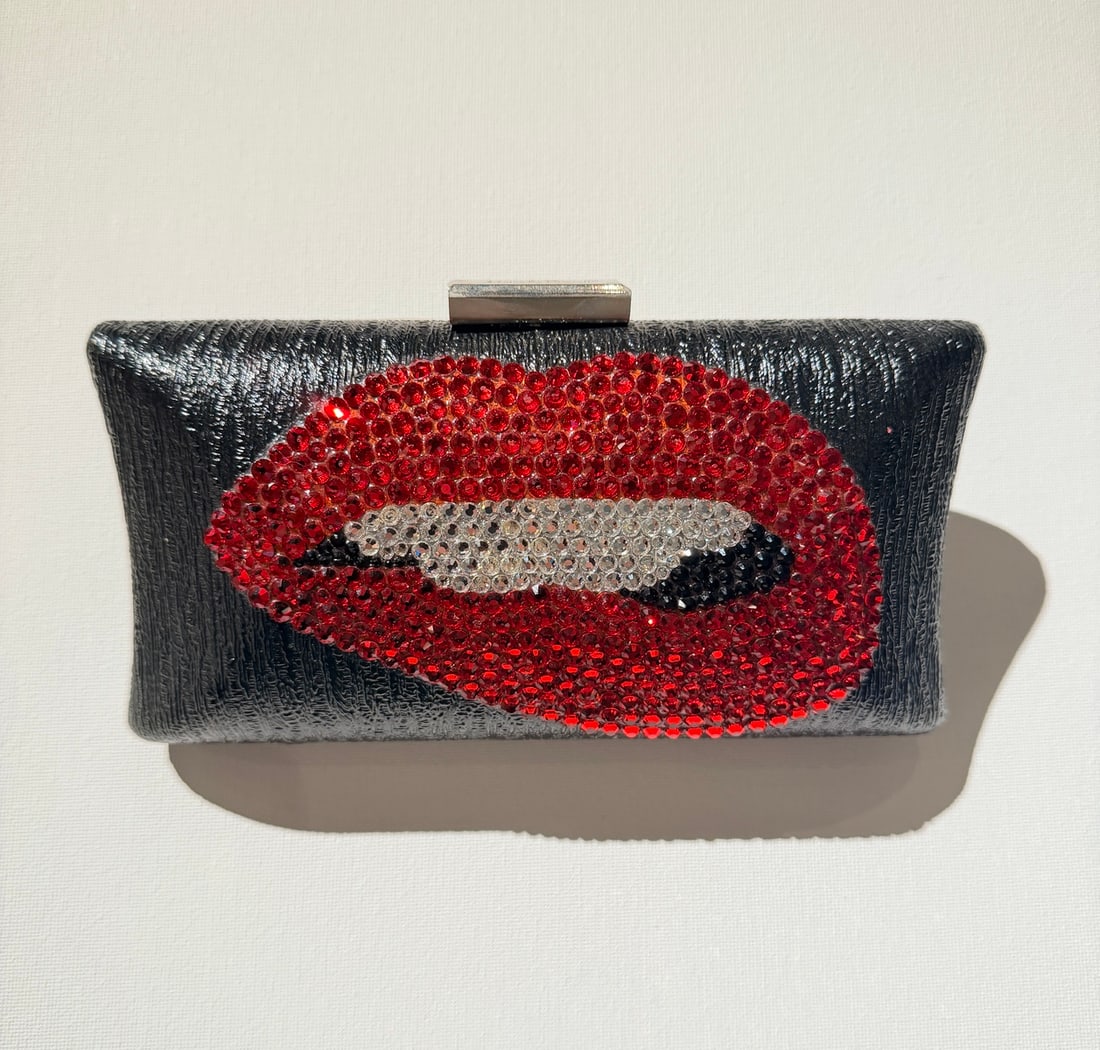 Mercedes Brunelli Jeweled Lips Clutch, Handmade in America, Swarovski Crystal: Artist: Mercedes Brunelli Title: Mercedes Brunelli Jeweled Lips Clutch, Handmade in America, Swarovski Crystal Art Dimensions: 3.75 x 2 x 7.5 inch ARTIST BIO: Mercedes Brunelli crafts more than access