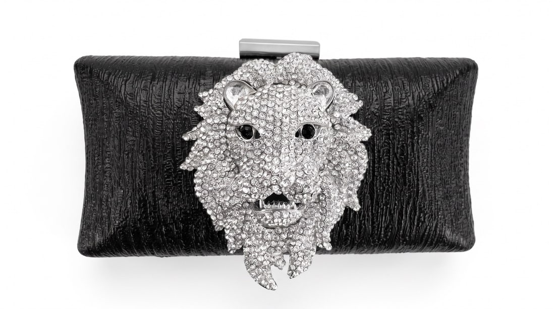 Mercedes Brunelli "The Signature" Lion Head Jeweled Clutch: Presenting this Mercedes Brunelli work: "Mercedes Brunelli "The Signature" Lion Head Jeweled Clutch". This piece, measuring 3.75 x 7.5 x 2 inch, is available at auction on LiveAuctioneers. Artist: