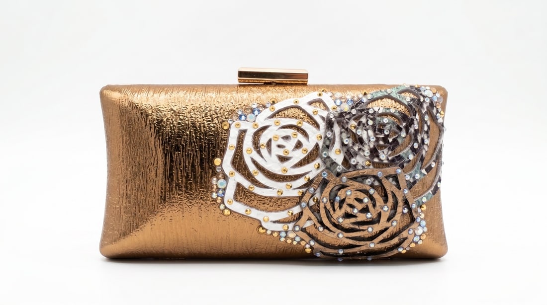 Mercedes Brunelli "Leather Roses" Jeweled Clutch: Presenting this Mercedes Brunelli work: "Mercedes Brunelli "Leather Roses" Jeweled Clutch". This piece, measuring 3.75 x 7.5 x 2 inch, is available at auction on LiveAuctioneers. Artist: Mercedes