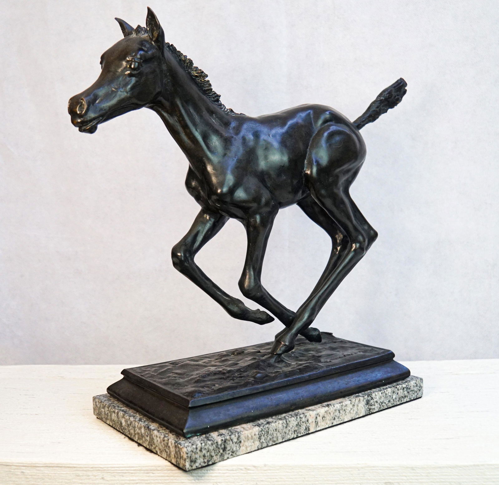 Adolf Sehring sculpture Born to Run: "Born to Run" by Adolf Sehring is a bronze sculpture measuring approximately 18" x 13".