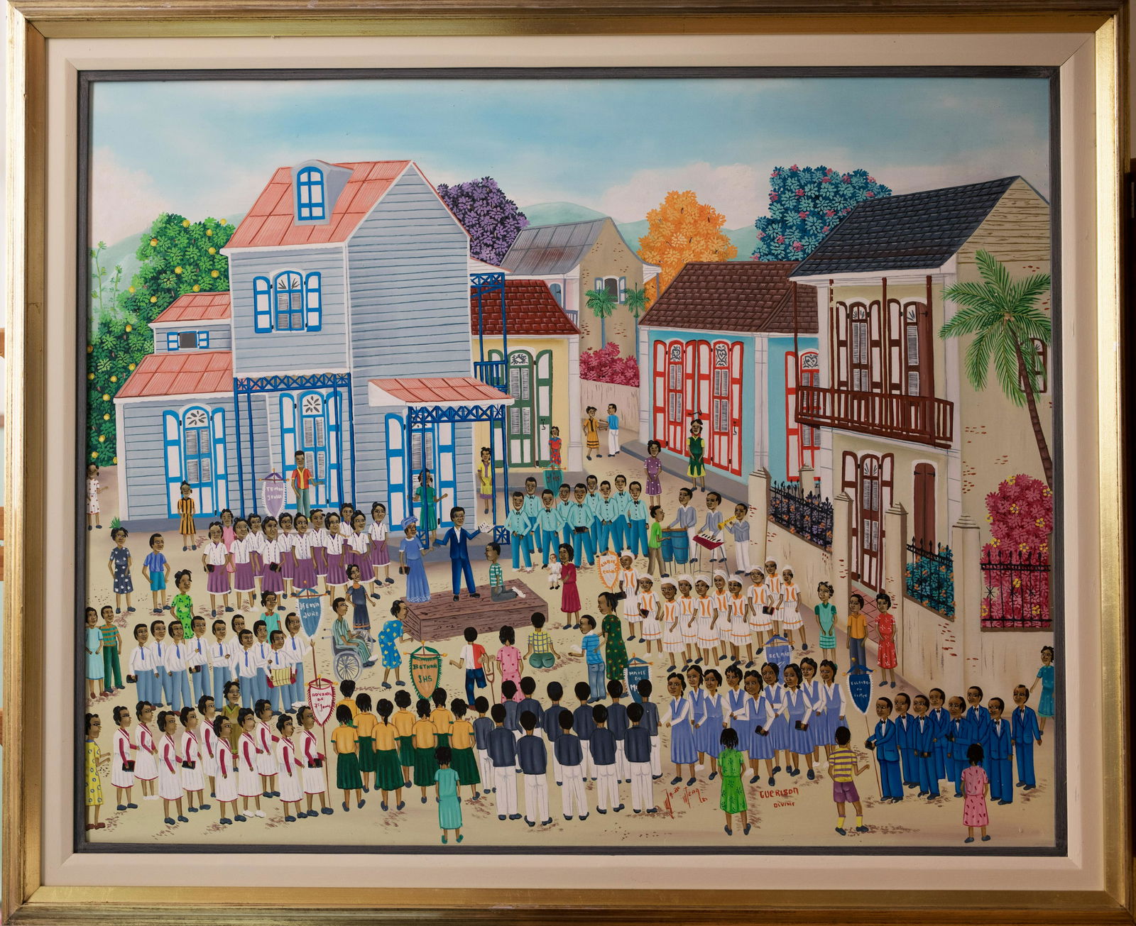 School Yard Celebration by Jean Baptiste Jean: School Yard Ceremonial Celebration by Jean Baptiste Jean is a Haitian oil on board painting. 19 X 35. Born in Cap Haitien in 1953. Studied with Philome Obin. Died in the Spring of 2002.