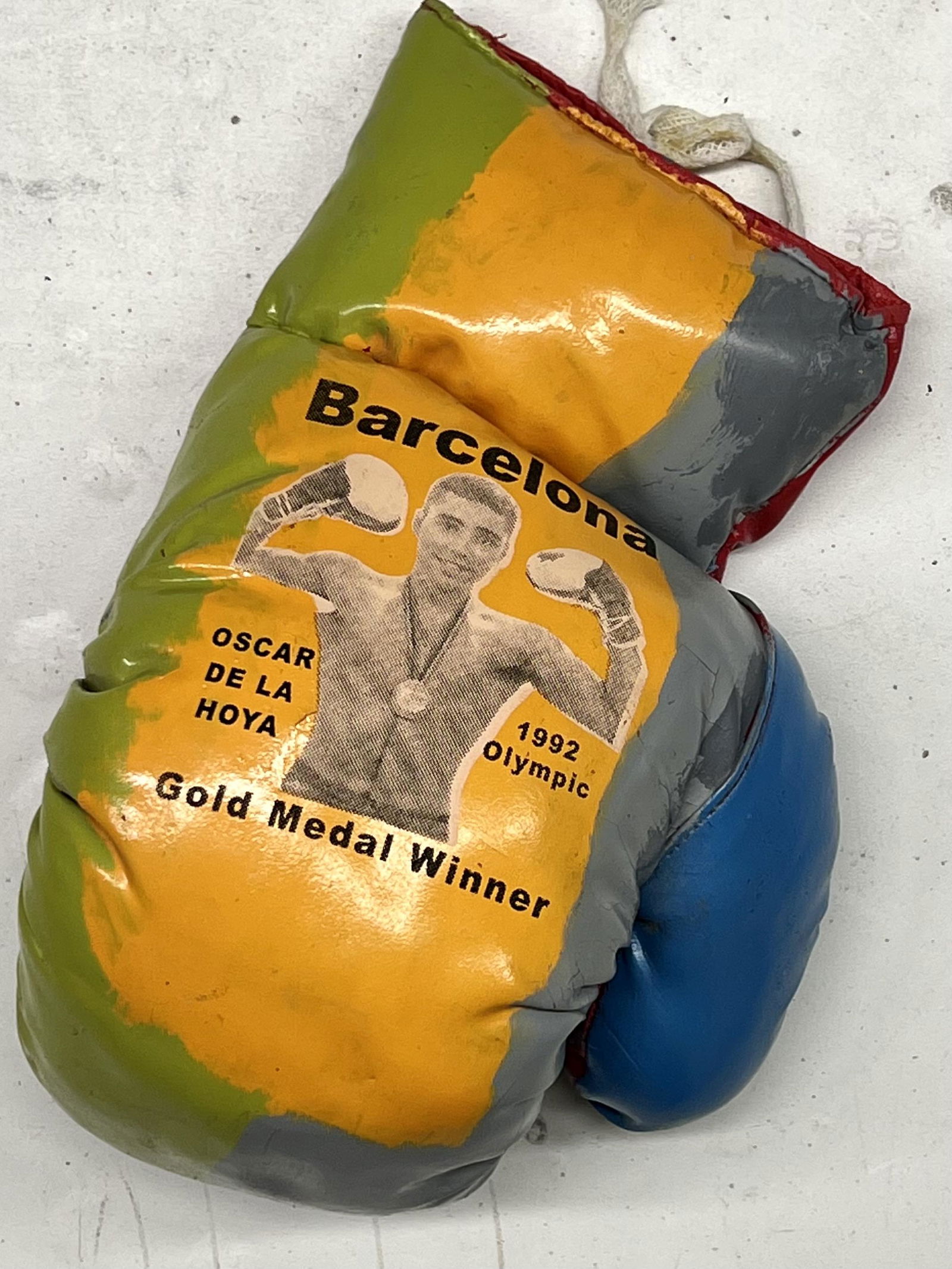 Oscar De La Hoya Gold Medal Winner by Steve Kaufman: Oscar De La Hoya Gold Medal Winner by Steve Kaufmanis a one of a kind mixed media boxing glove collectible hand signed by Steve Kaufman. Steve Kaufman was the apprentice of Andy Warhol. This piece cam