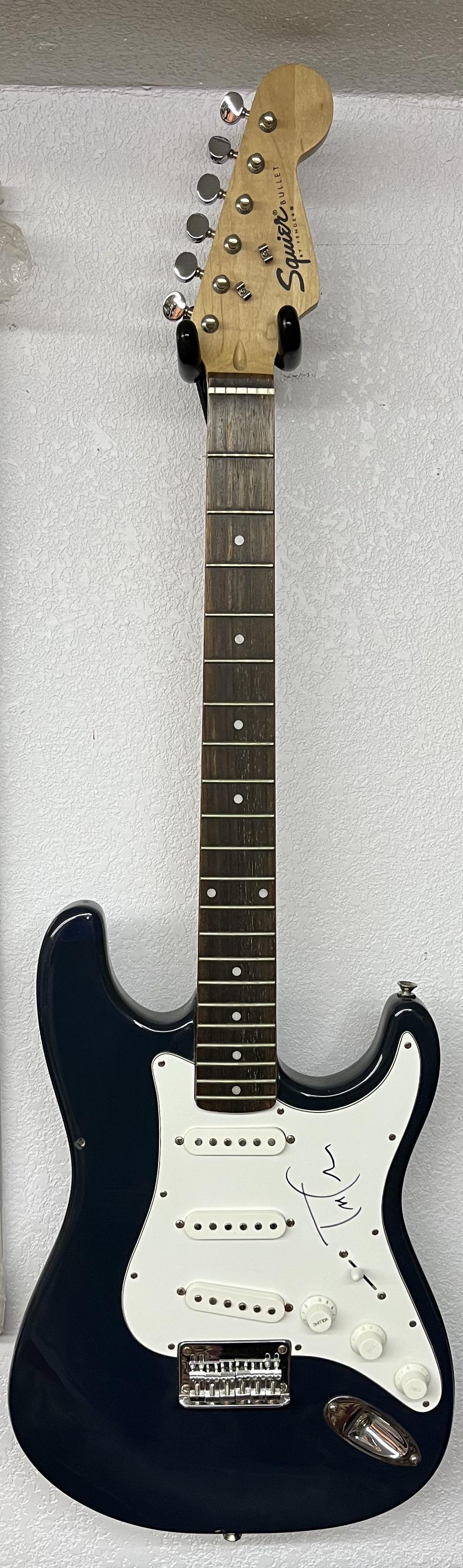 Squire by Fender Guitar Signed by Tom Petty: Squire Bullet by Fender Guitar Signed by Tom Pettysigned by the named artist. This piece came from a private collector with unknown origination and authentication. This comes with a certificate of aut